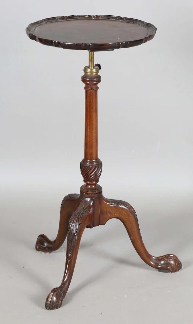 An early 20th century George III style mahogany wine table, the circular