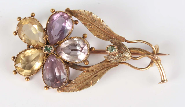 An early 19th century gold, amethyst, citrine and green gem set brooch