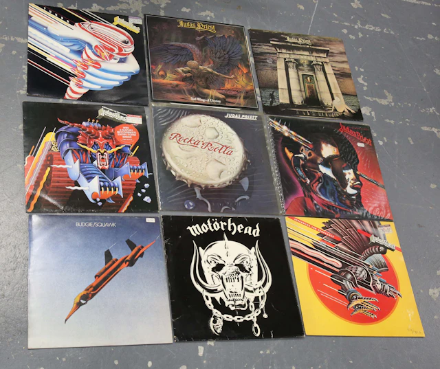 A collection of approximately ninety-eight LP records, mainly rock