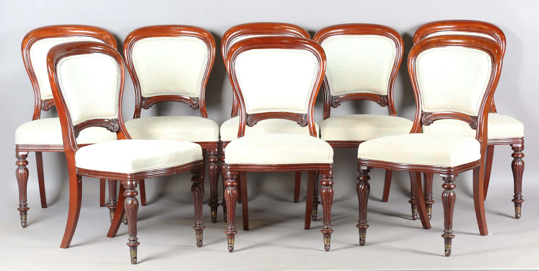 A good set of eight mid-Victorian mahogany showframe spoon back dining