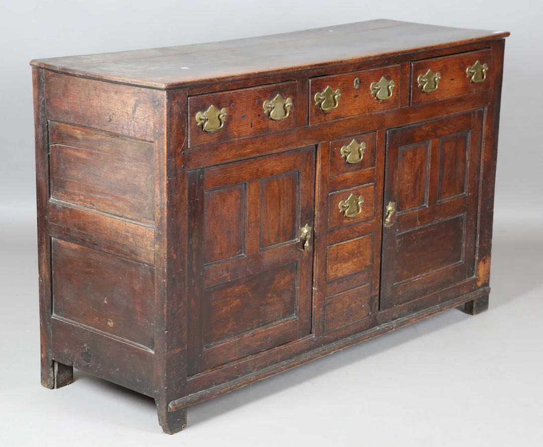 An 18th century oak dresser base, fitted with an arrangement of drawers