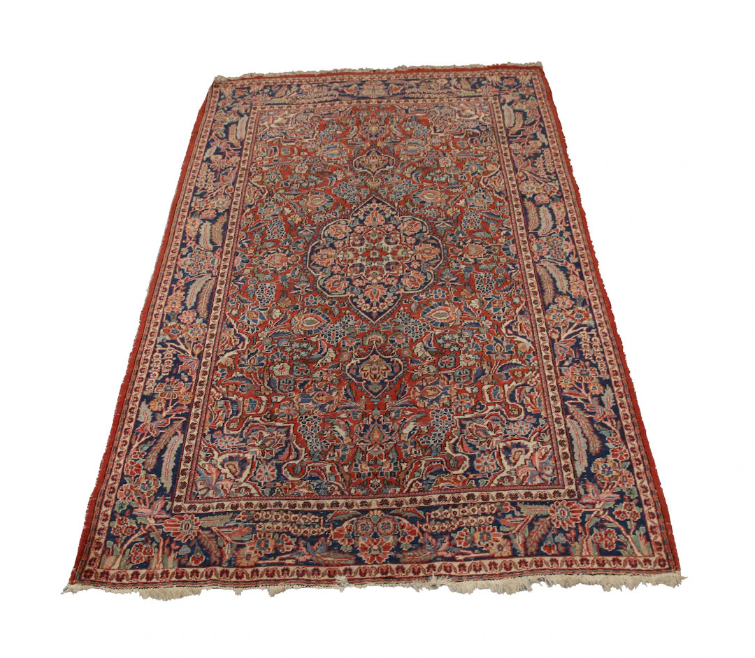 A Kashan rug, Central Persia, early 20th century, the red field with