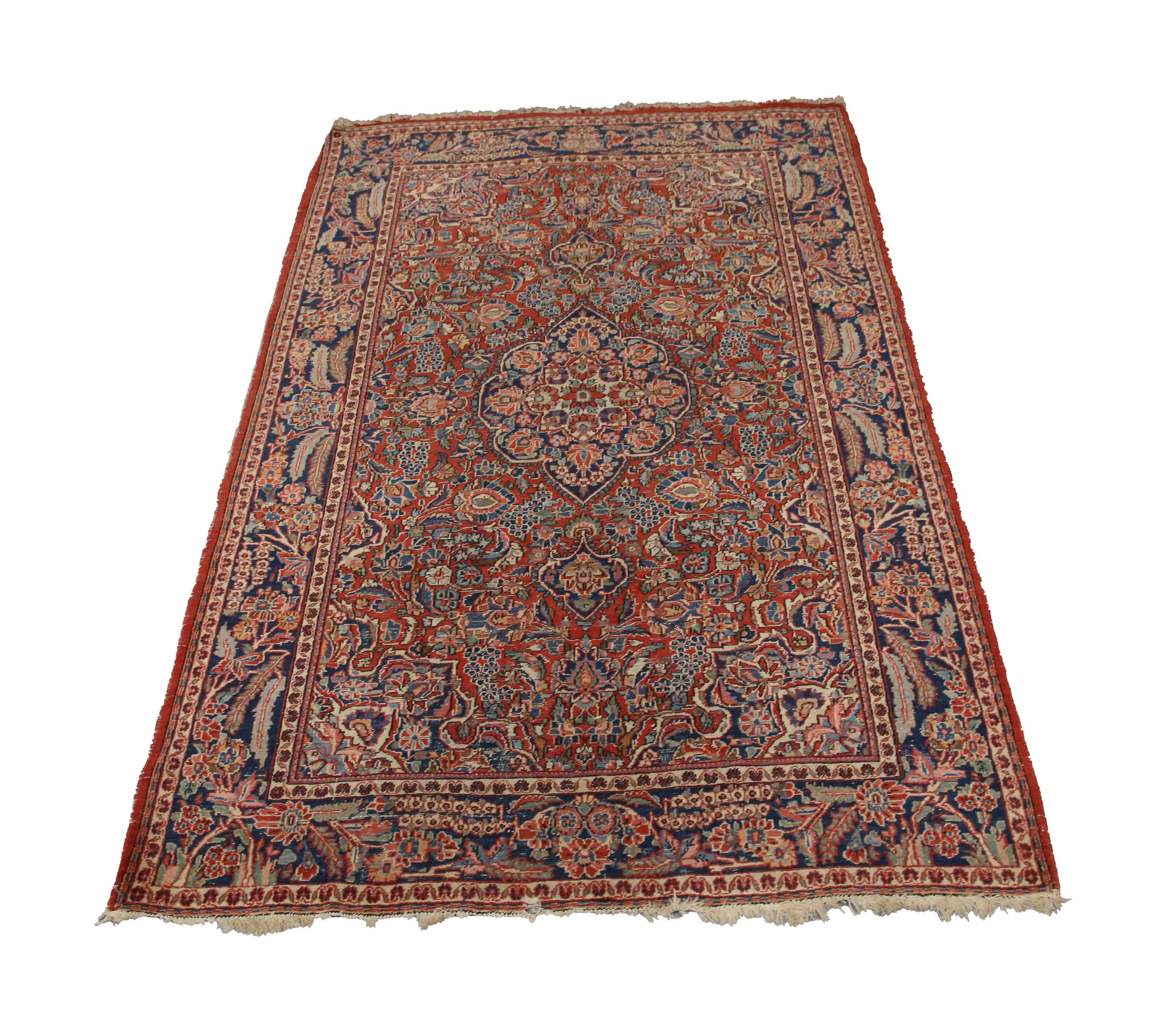 A Kashan rug, Central Persia, early 20th century, the red field with