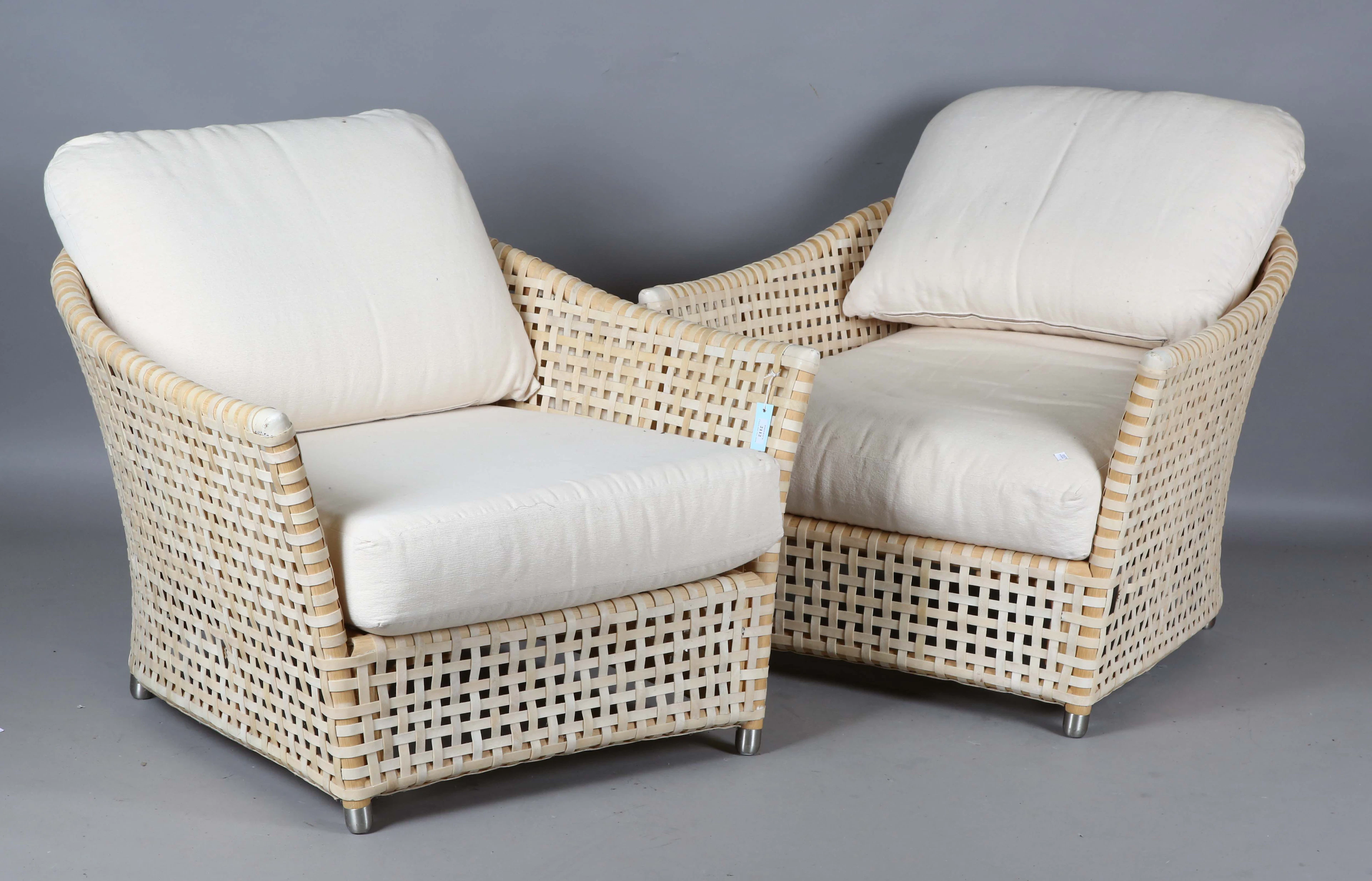 A pair of modern Italian woven parchment and beech framed armchairs