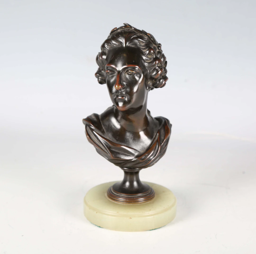 A 19th century French brown patinated cast bronze head and shoulders