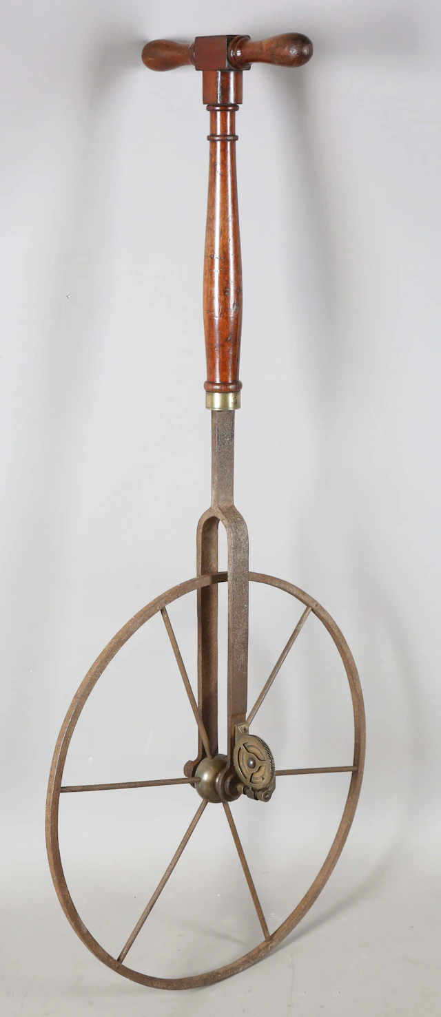 A 19th century mahogany handled 'waywiser' or surveyor's wheel, the