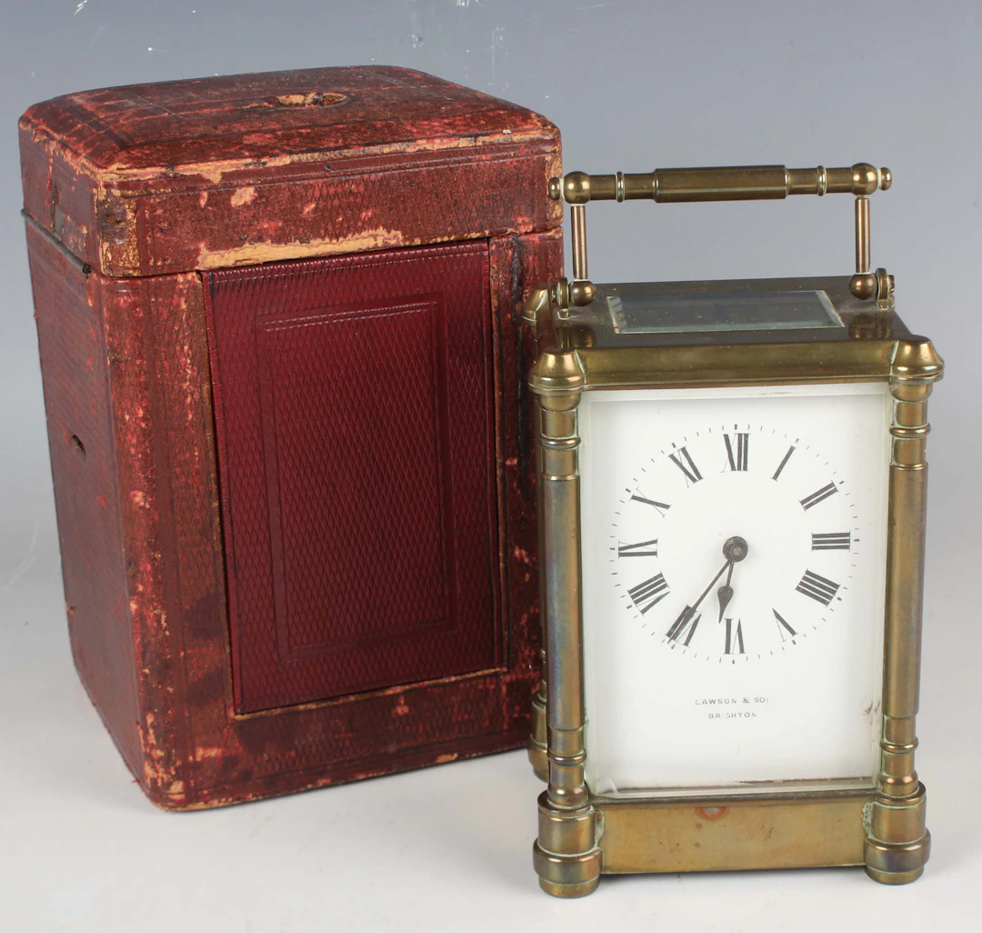 A late 19th/early 20th century brass carriage timepiece, the white
