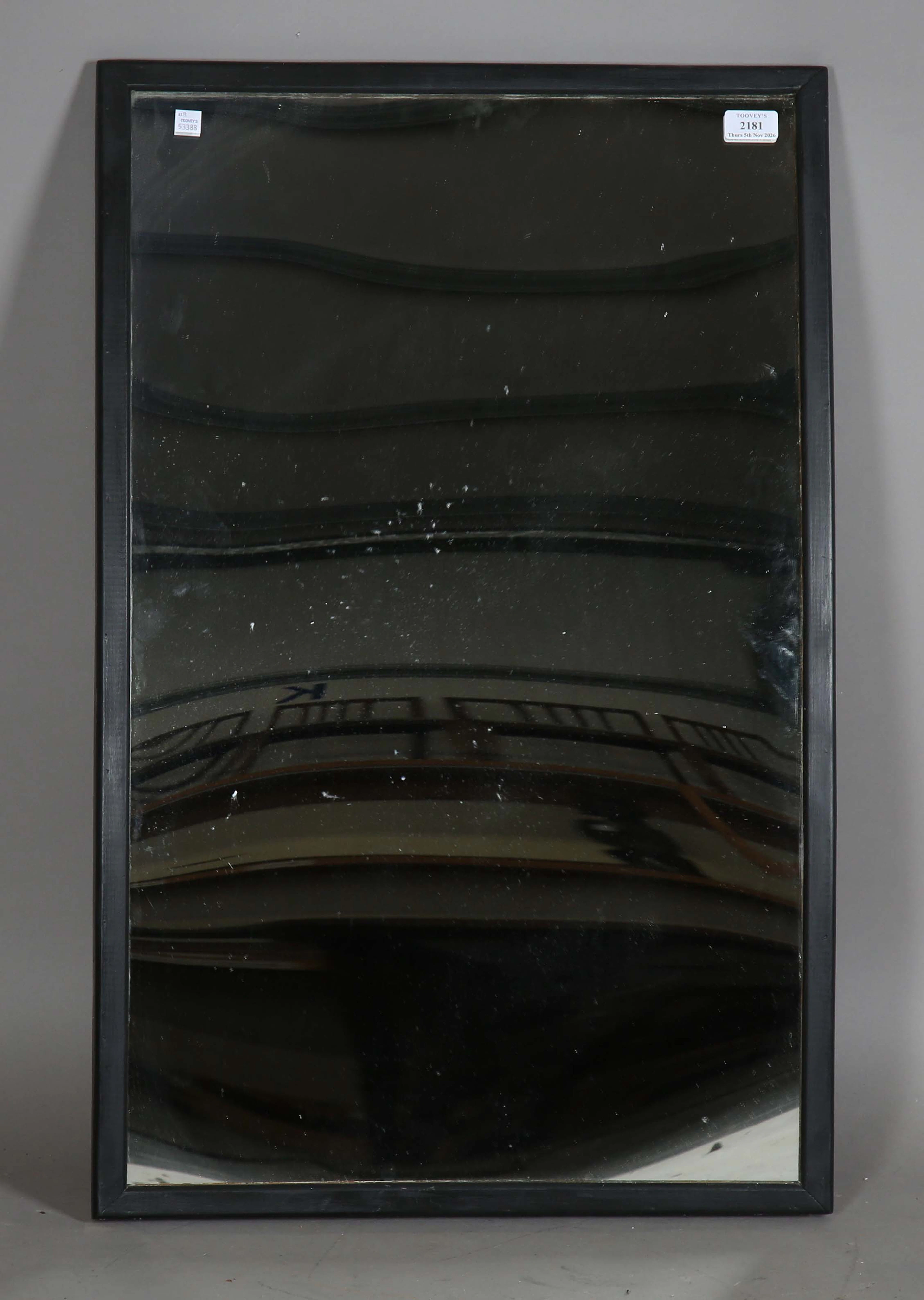An early 20th century black painted wooden framed distortion circus