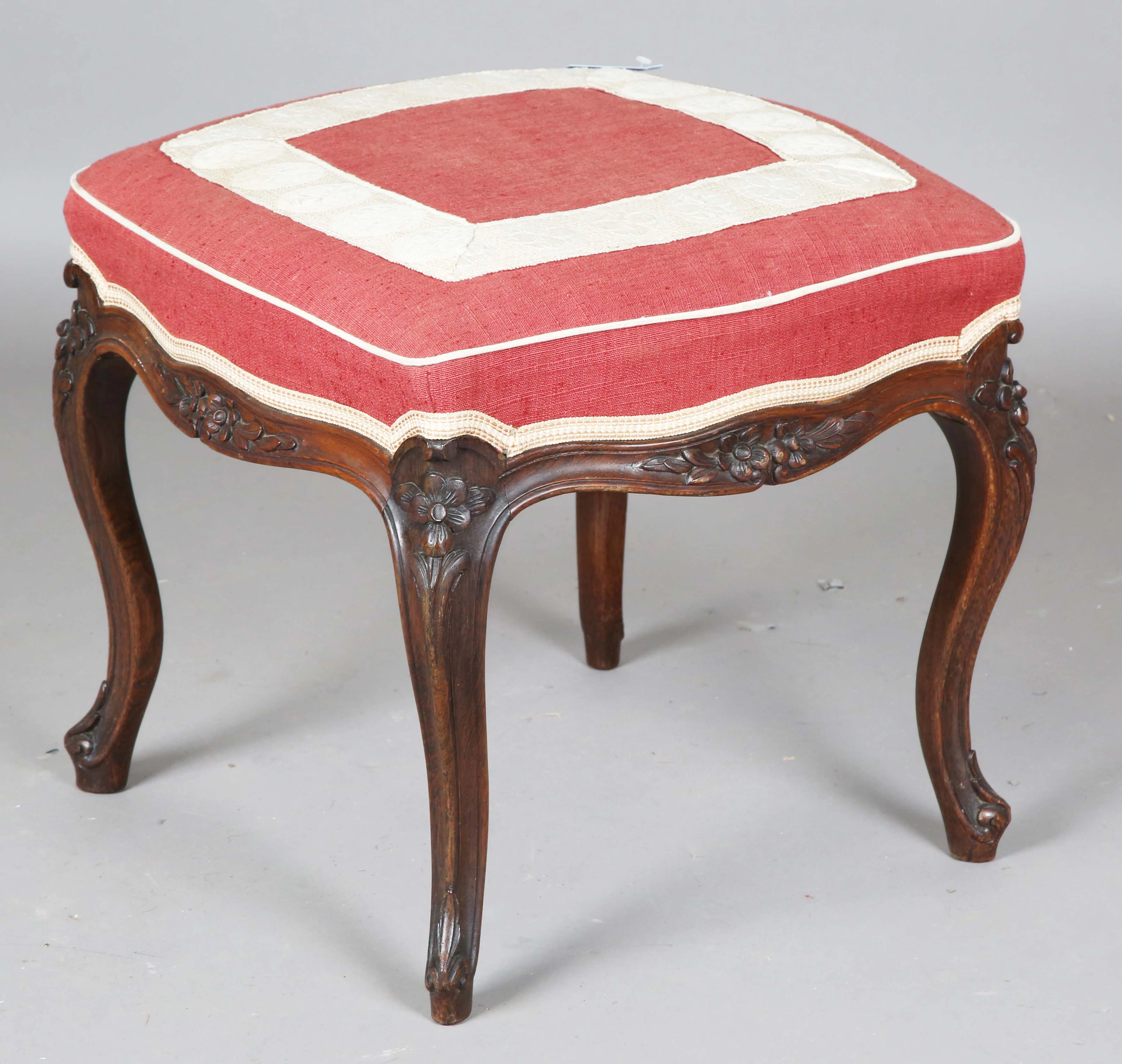 A mid-Victorian rosewood stool, the overstuffed seat on finely carved