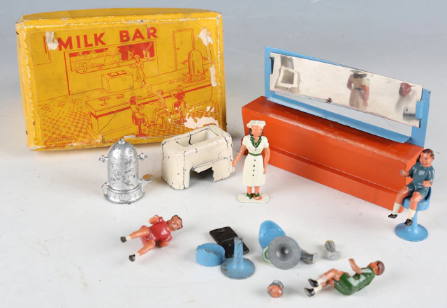 A Crescent Toys No. 1237 Milk Bar diecast metal set with three seated