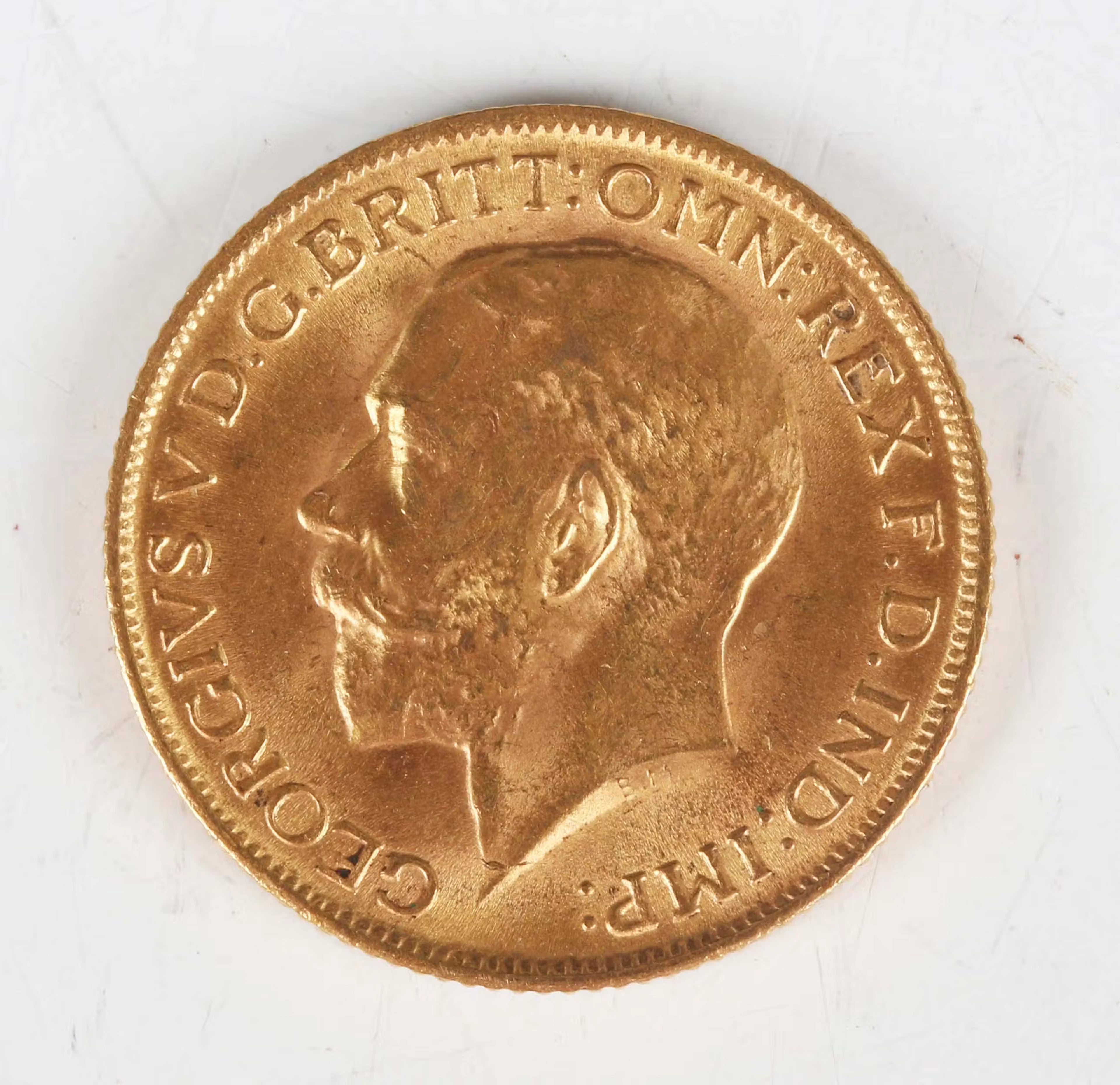 A George V sovereign 1915. Note: this lot includes an HMRC classified