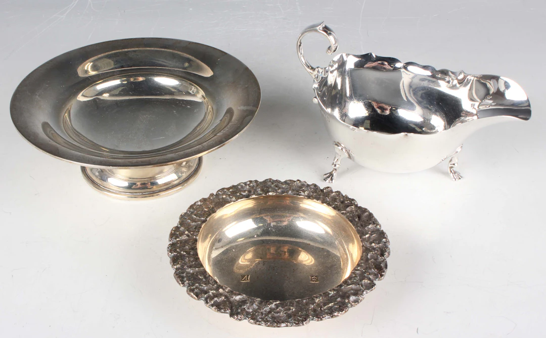 An Elizabeth II silver circular dish with cast naturalistic outswept