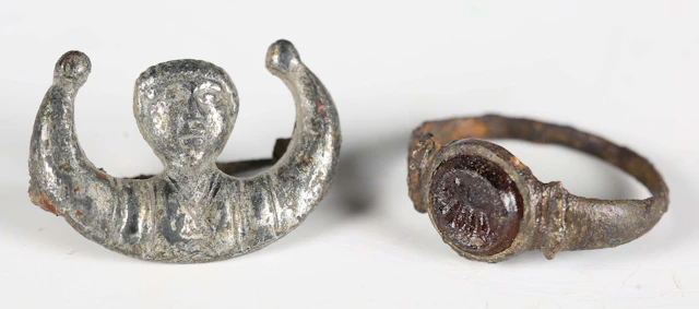 An ancient Roman silvered alloy figural brooch, formed as the head