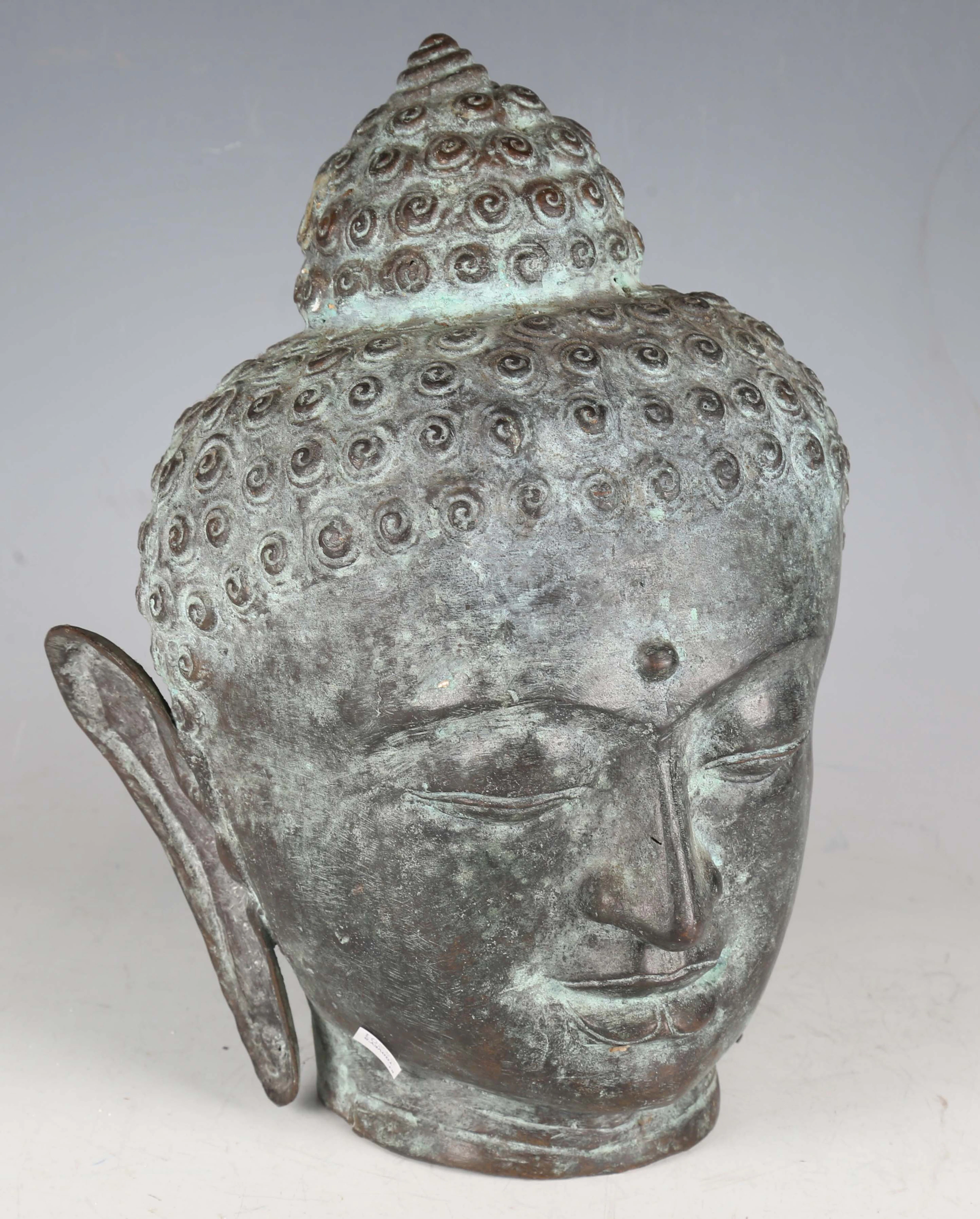 A South-east Asian verdigris bronze head of a Buddha, height 33cm.
