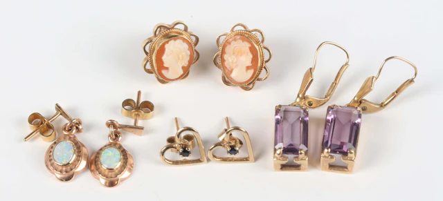 A pair of 9ct gold and opal single stone pendant earrings, each opal