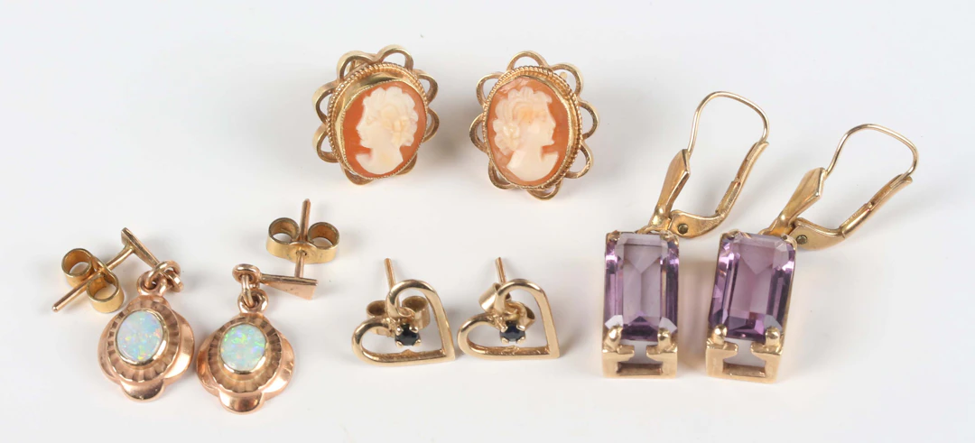 A pair of 9ct gold and opal single stone pendant earrings, each opal