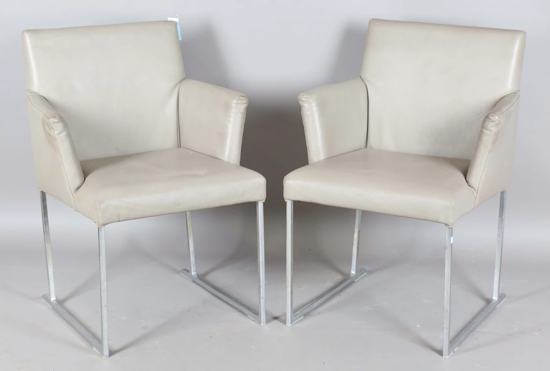 A pair of modern B & B Italia grey leather and chromium plated elbow