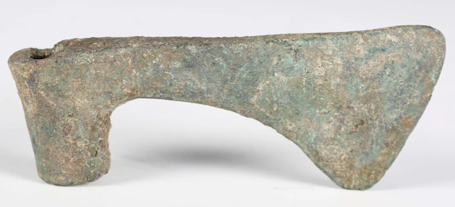 A Luristan Iron Age bronze axe head, circa 900-700 BC, length 11.5cm.