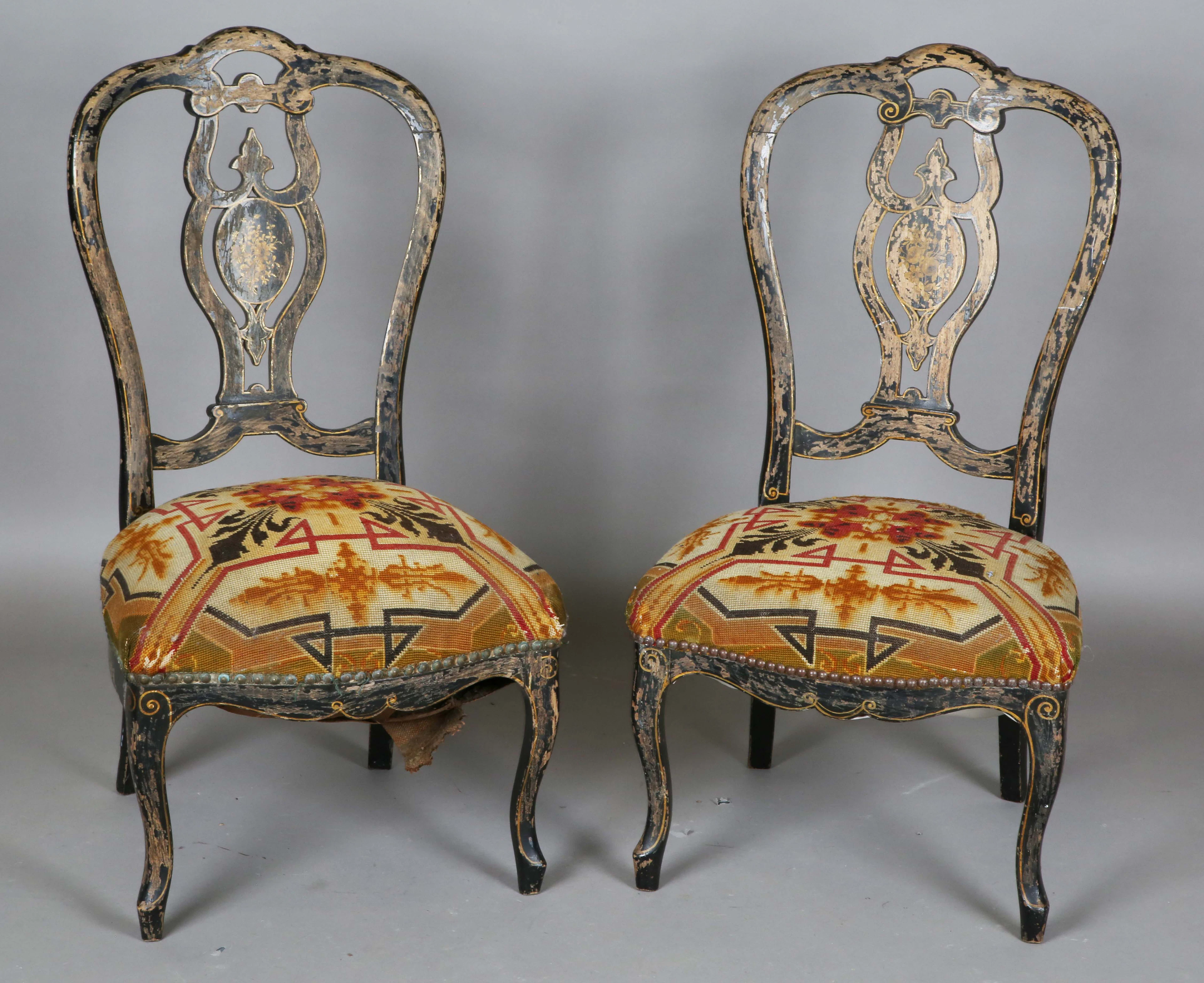 A pair of late Victorian ebonized and gilt decorated salon chairs