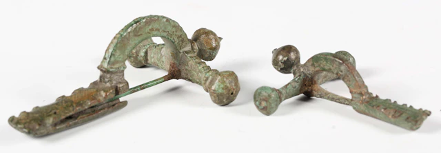 Two ancient Roman verdigris copper alloy crossbow type brooches, lengths