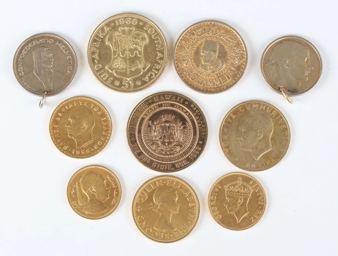 A group of silver-gilt and gilt base metal coins and medallions, including