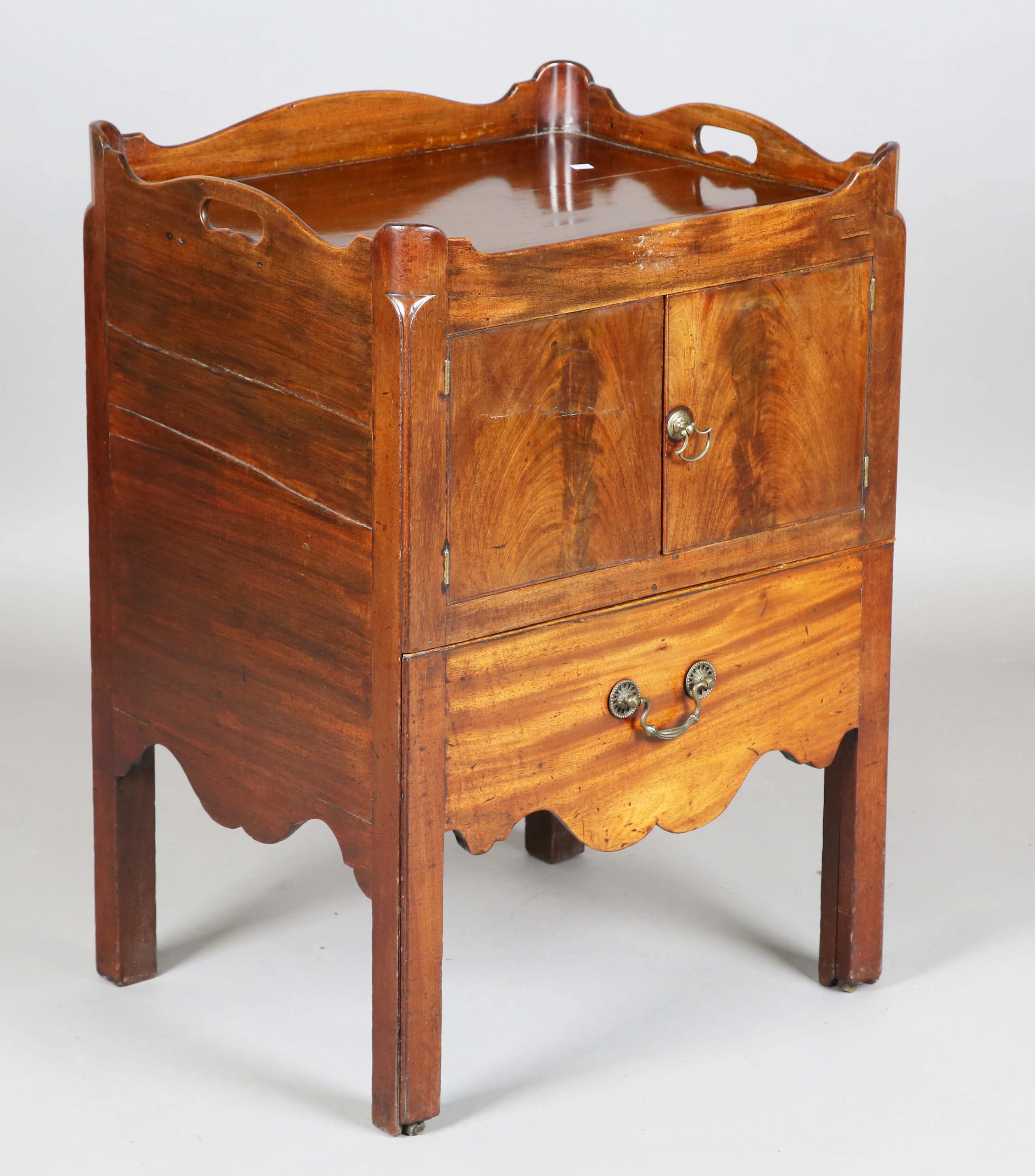A George III mahogany night cupboard, the gallery top above two doors