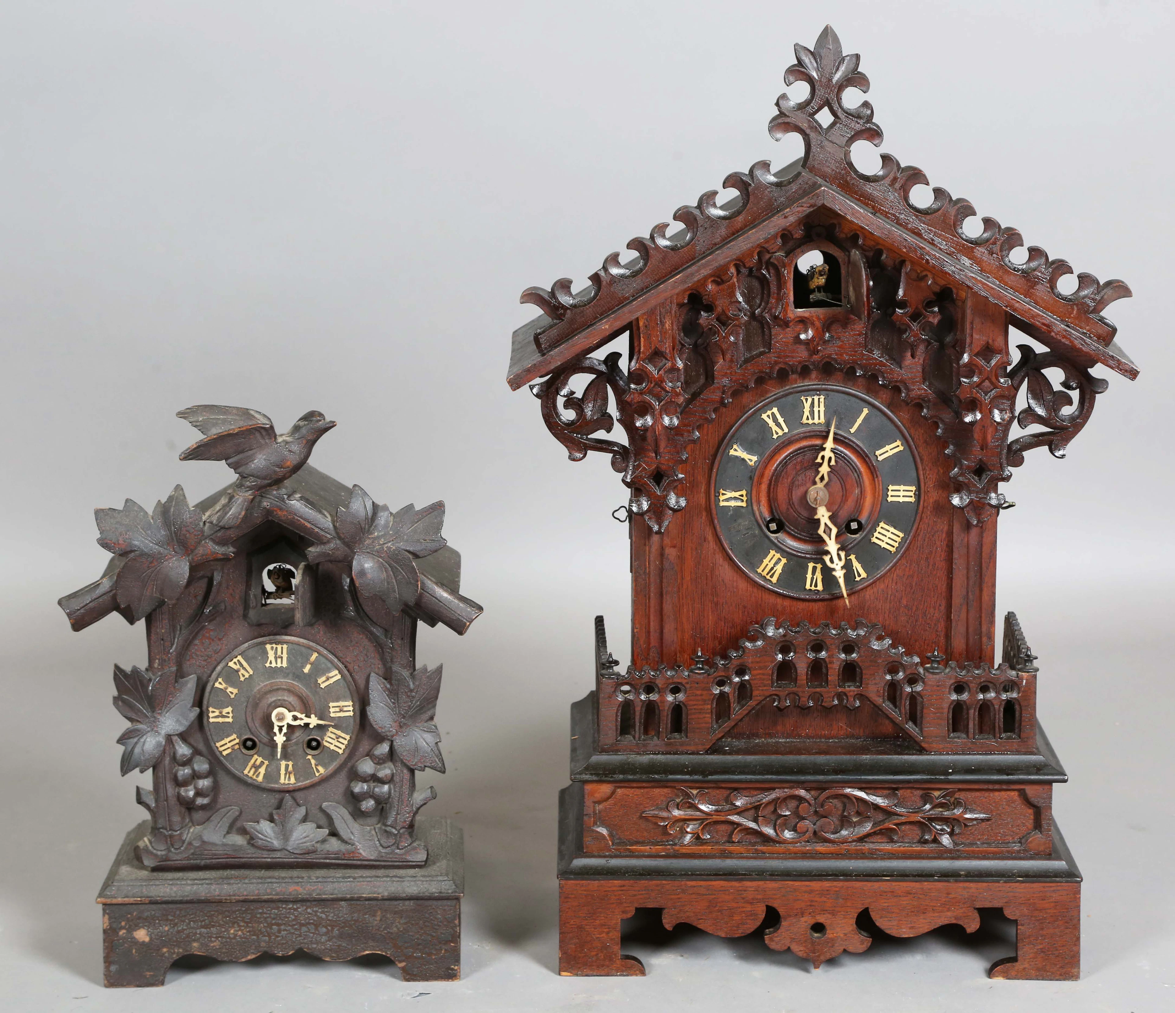 A late 19th century Black Forest oak cased cuckoo mantel clock with