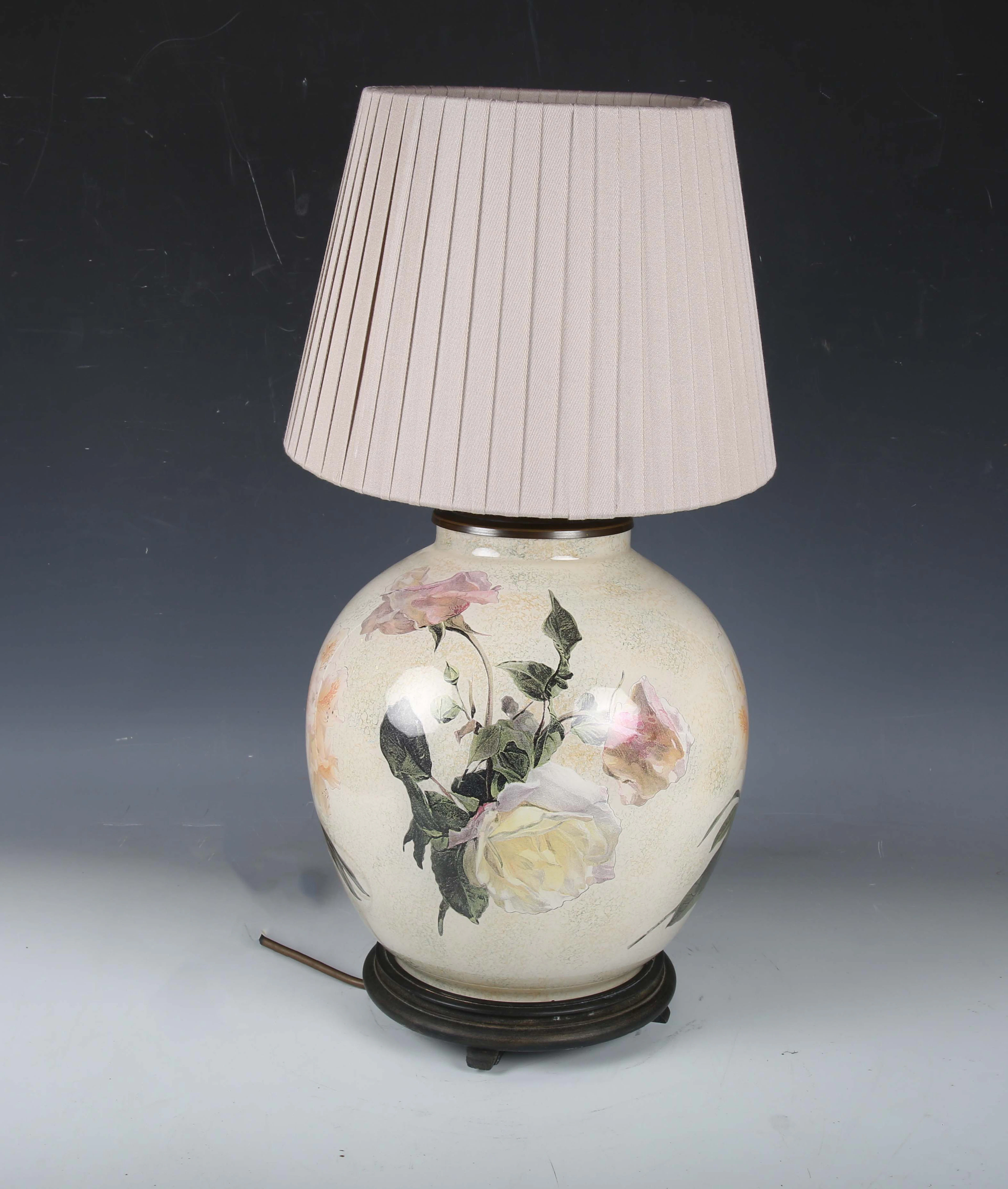 A modern reverse printed glass table lamp with pleated fabric shade