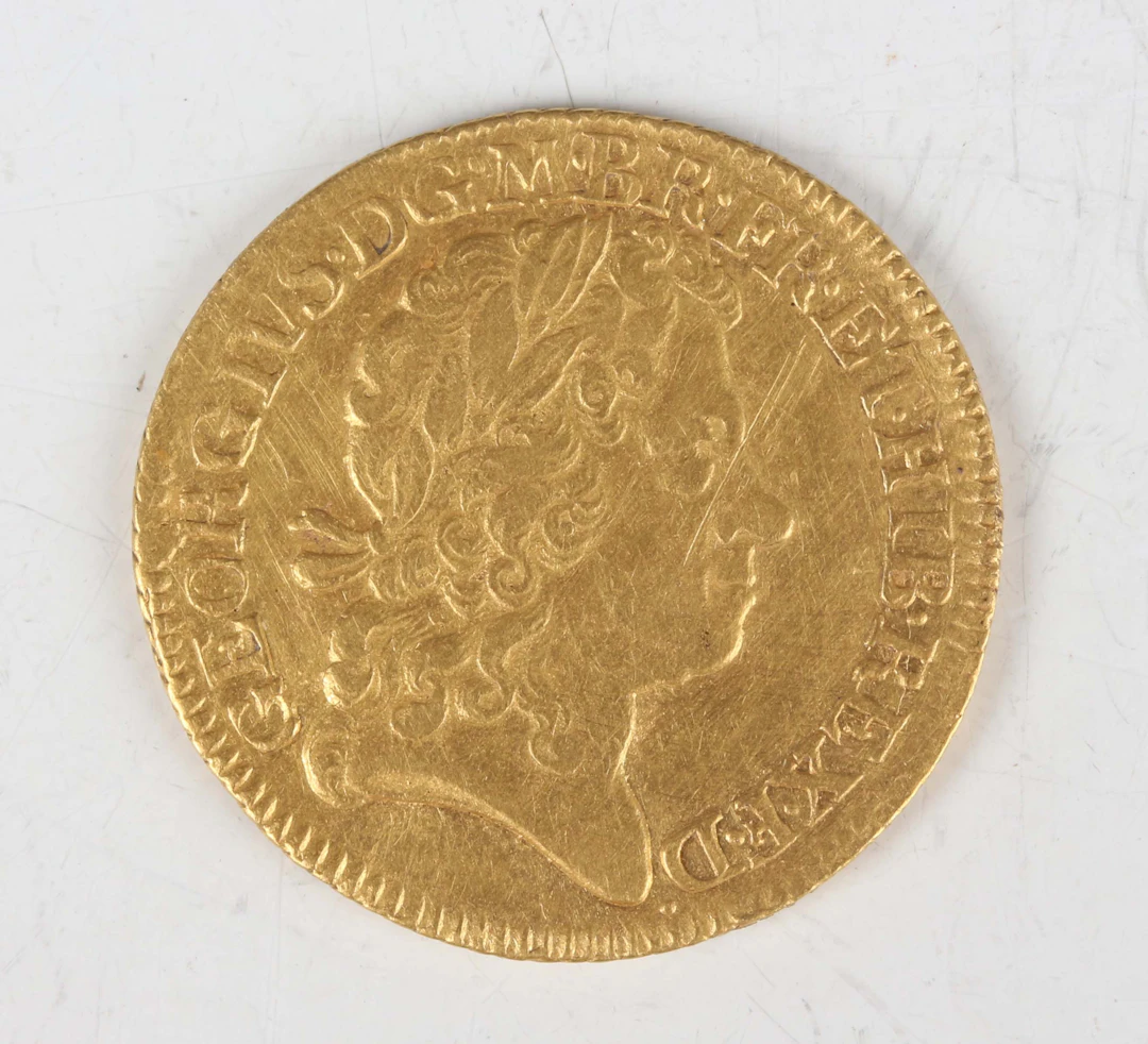 A scarce George I guinea 1721, fourth bust, tie with loop to hair