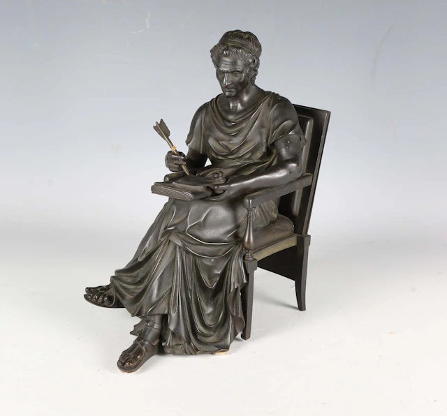 A 19th century Grand Tour brown patinated cast bronze figure of a