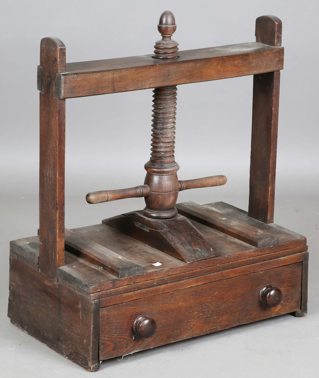 A 19th century stained pine table-top bookpress, fitted with a large