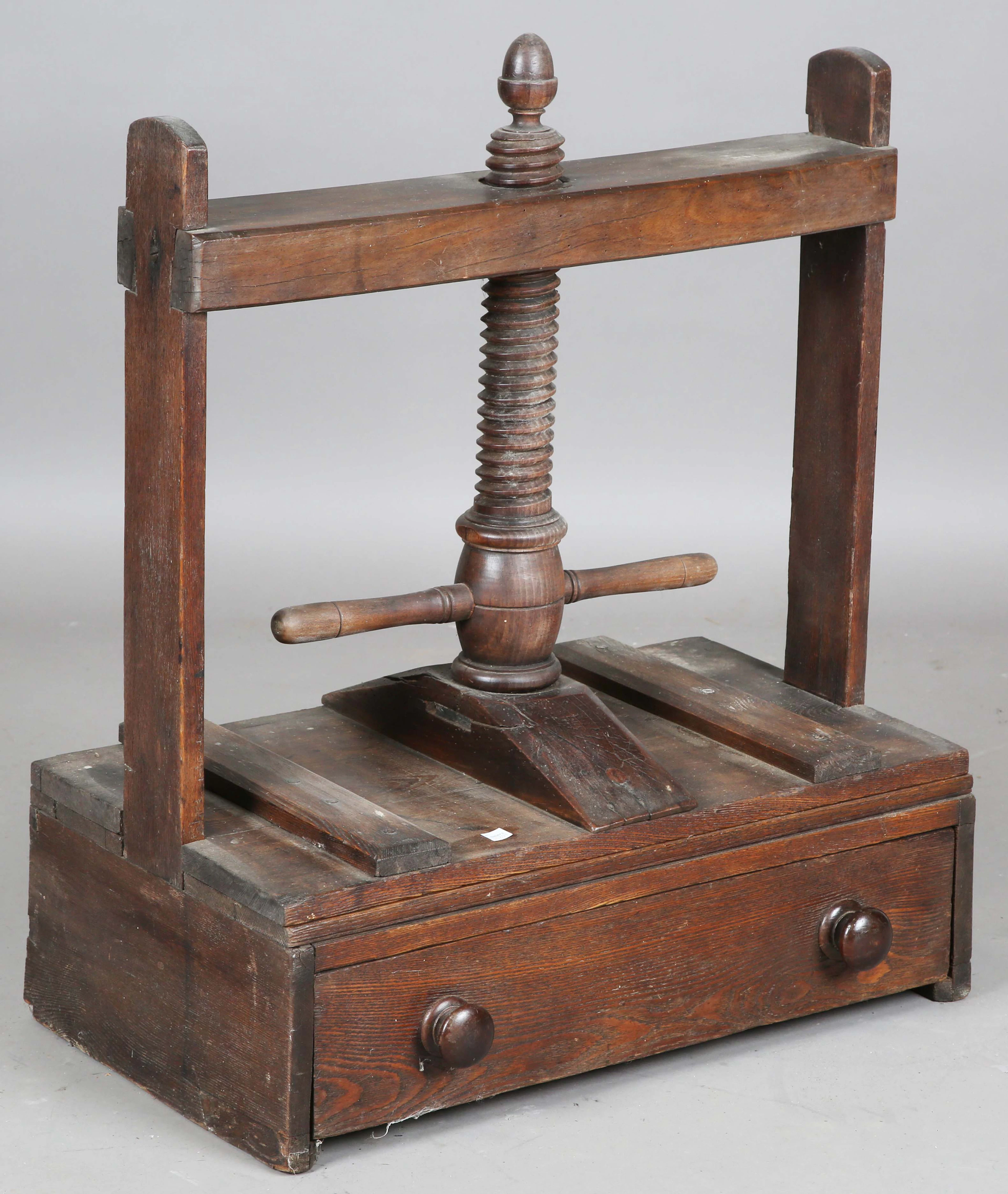 A 19th century stained pine table-top bookpress, fitted with a large