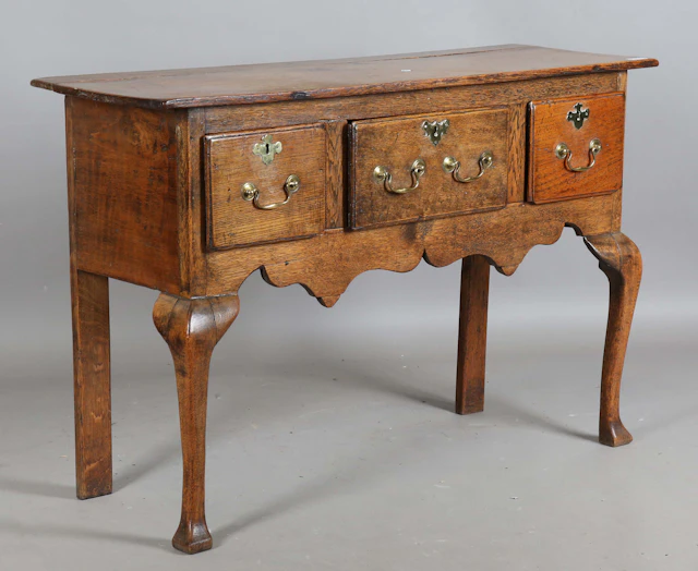 An 18th century and later provincial oak dresser base of small proportions