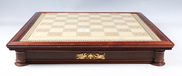 A Franklin Mint bisque porcelain 'The Chess Set of the Gods', within