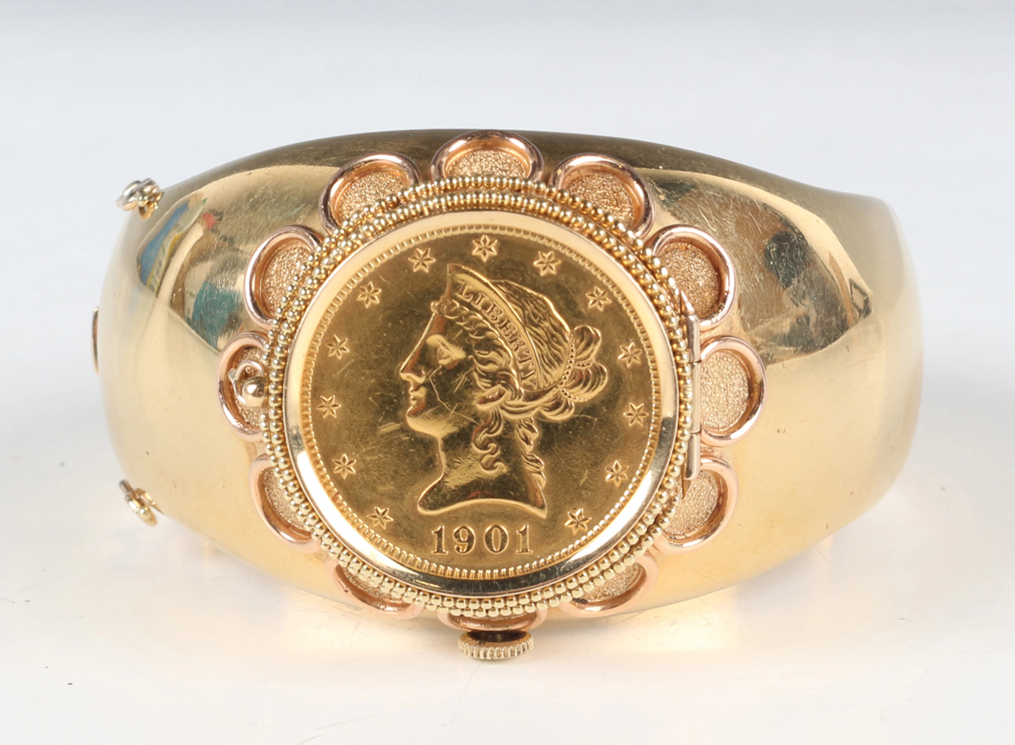A Nicolet two-colour gold hinged bangle wristwatch, the front with