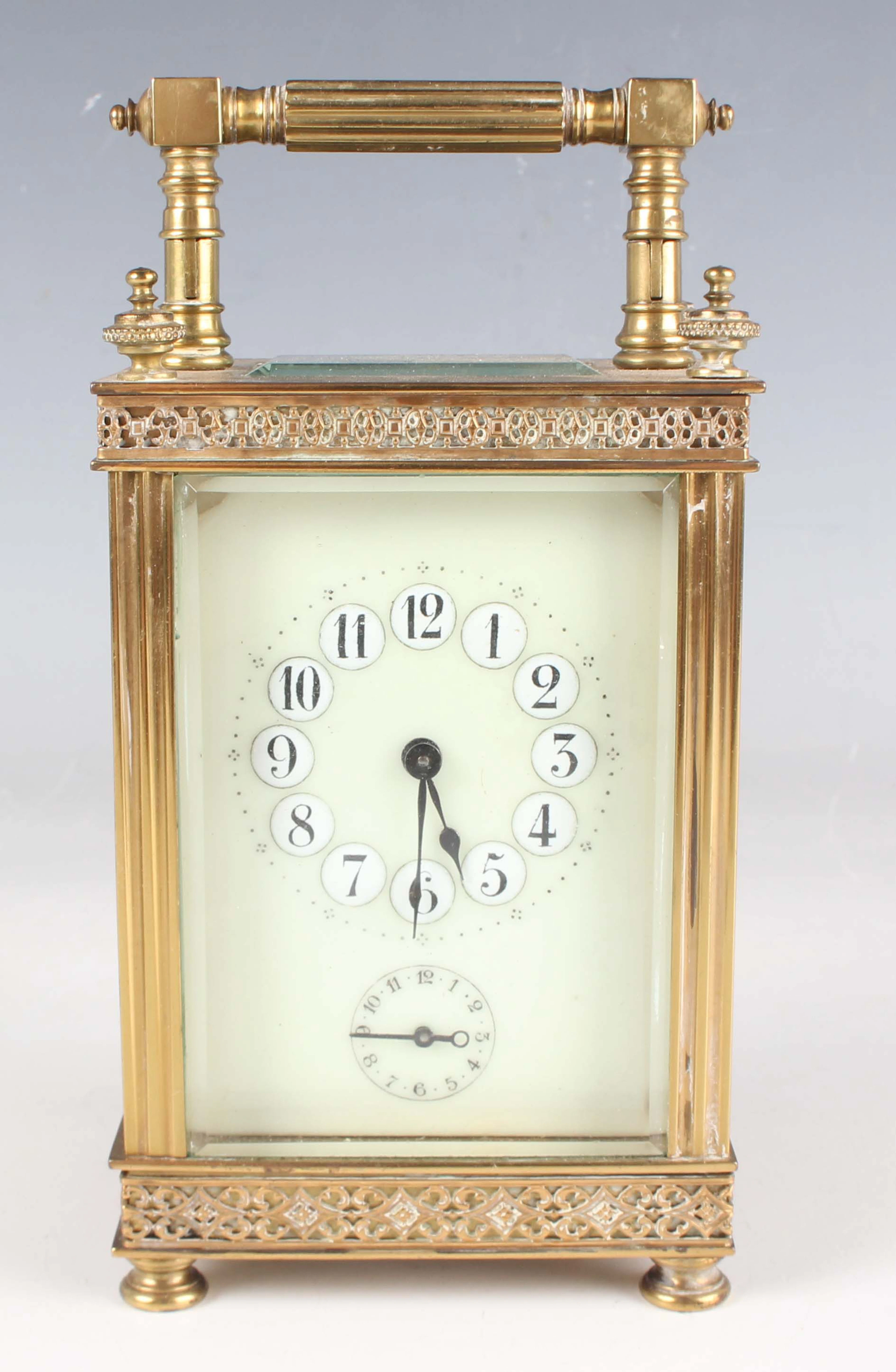 A late 19th century French brass cased carriage alarm clock with eight