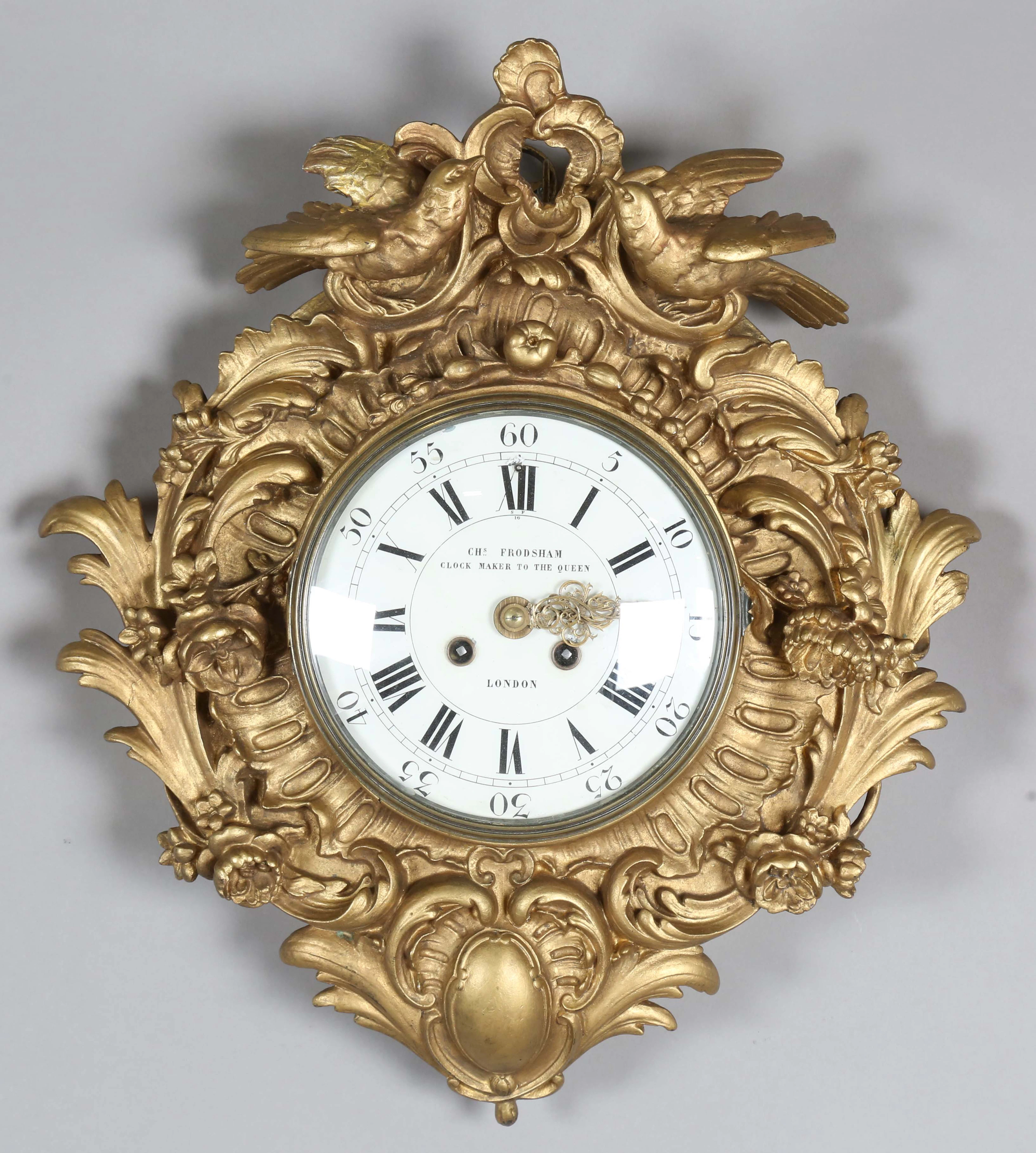A late 19th century giltwood and gesso cased wall clock with eight