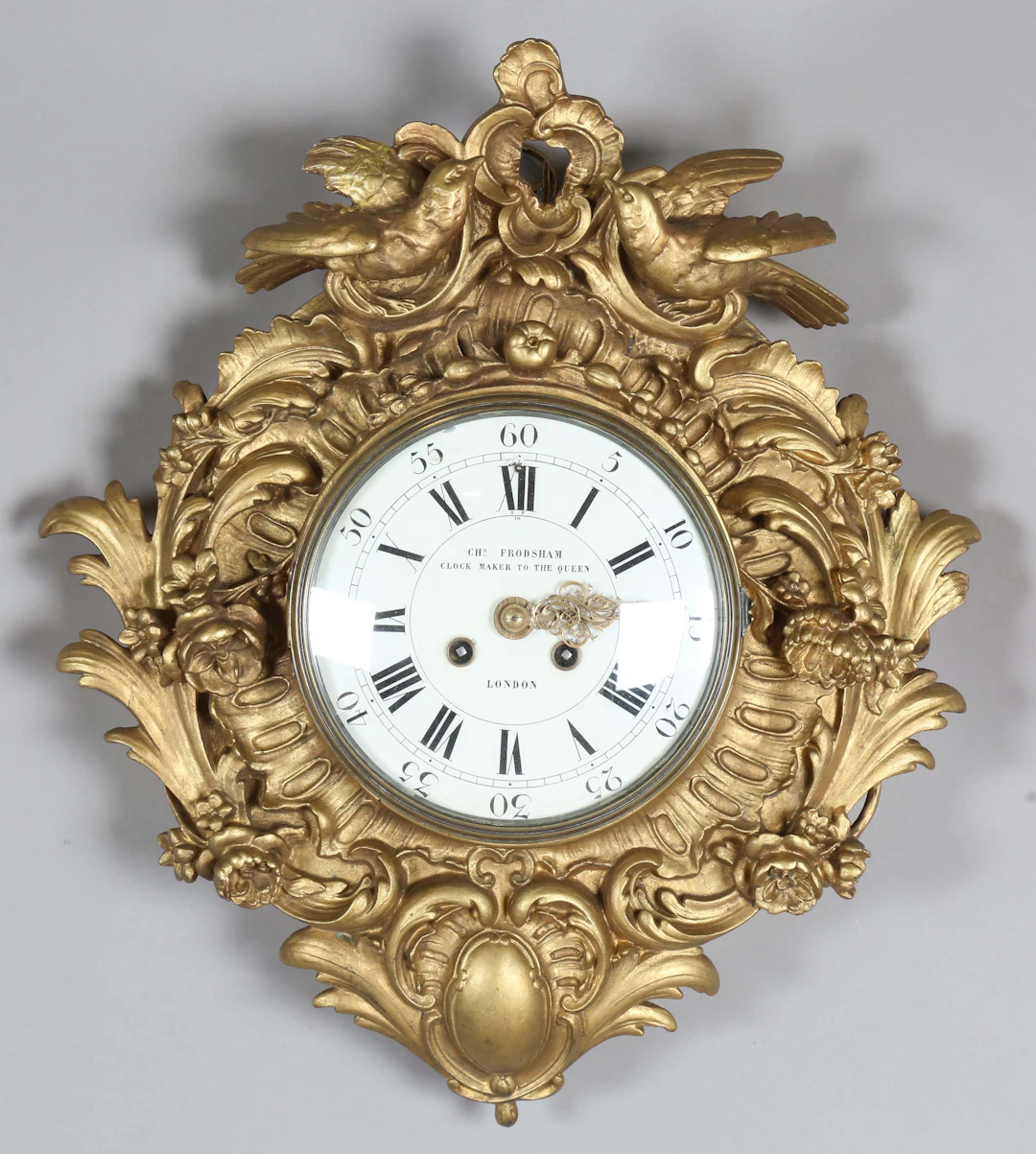 A late 19th century giltwood and gesso cased wall clock with eight