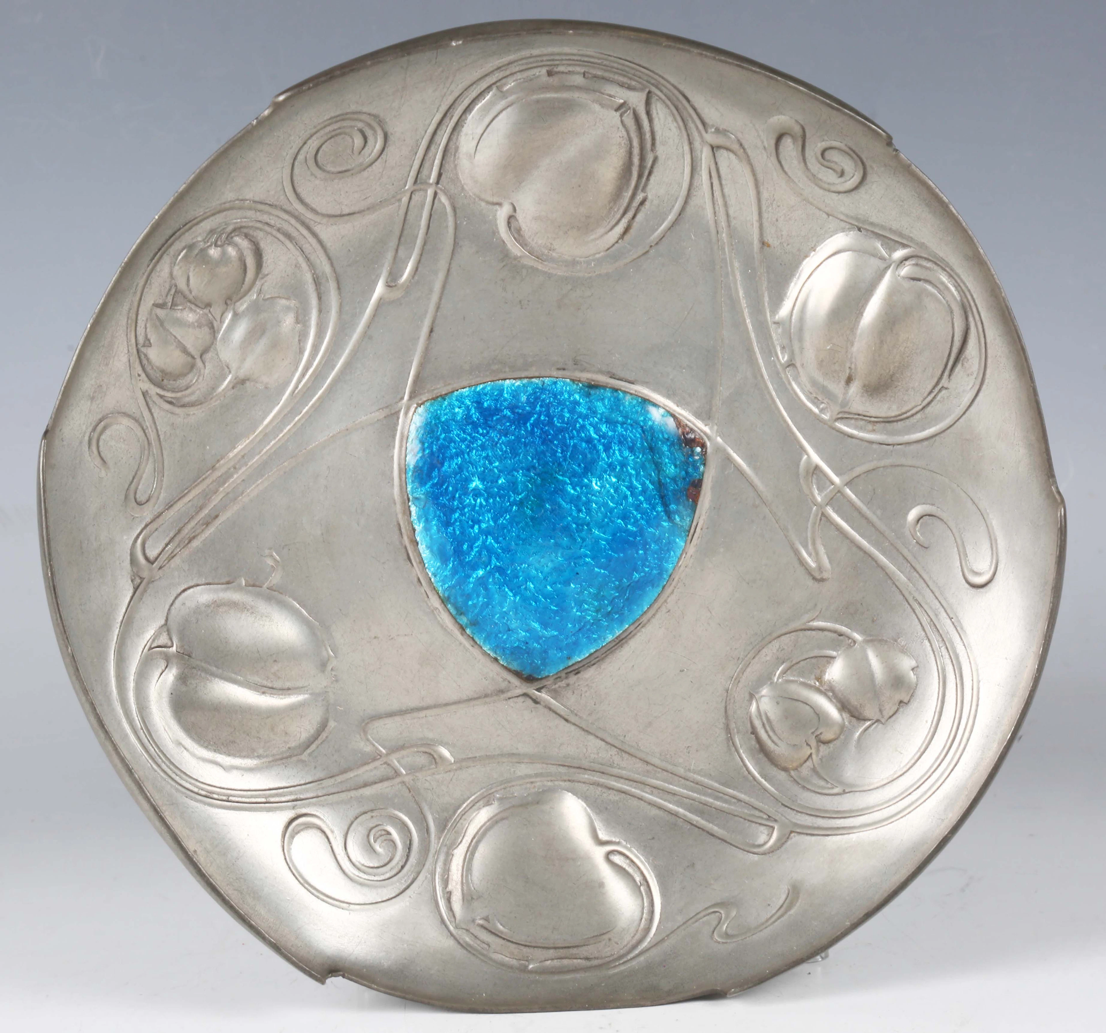 A Liberty & Co 'Tudric' pewter and enamel circular dish, designed