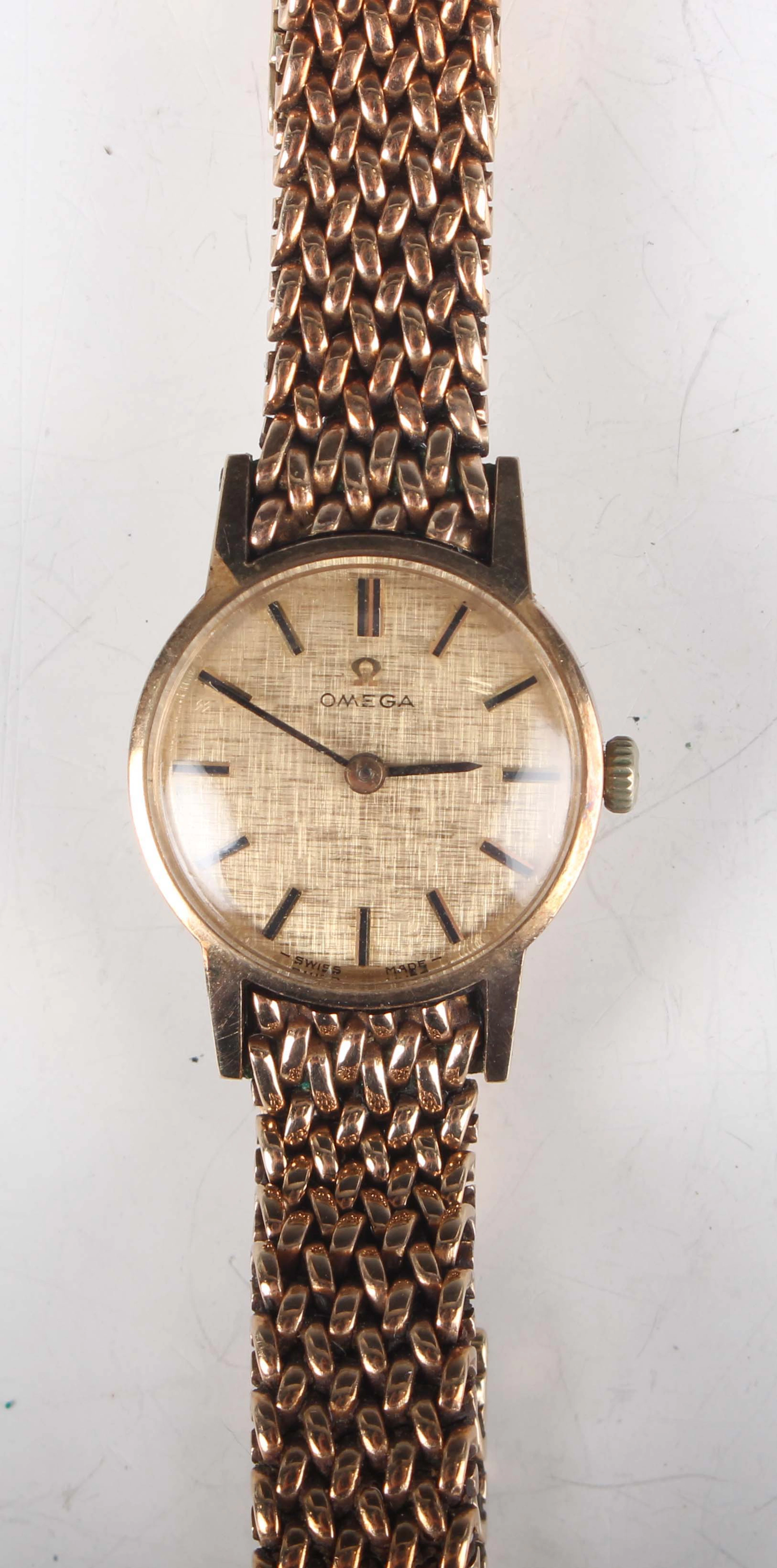 An Omega 9ct gold circular cased lady's wristwatch, the signed and