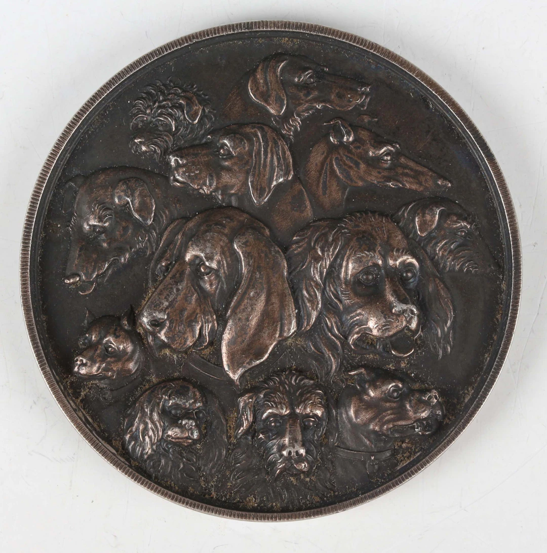 An unusual 19th century white metal medallion, obverse detailed with