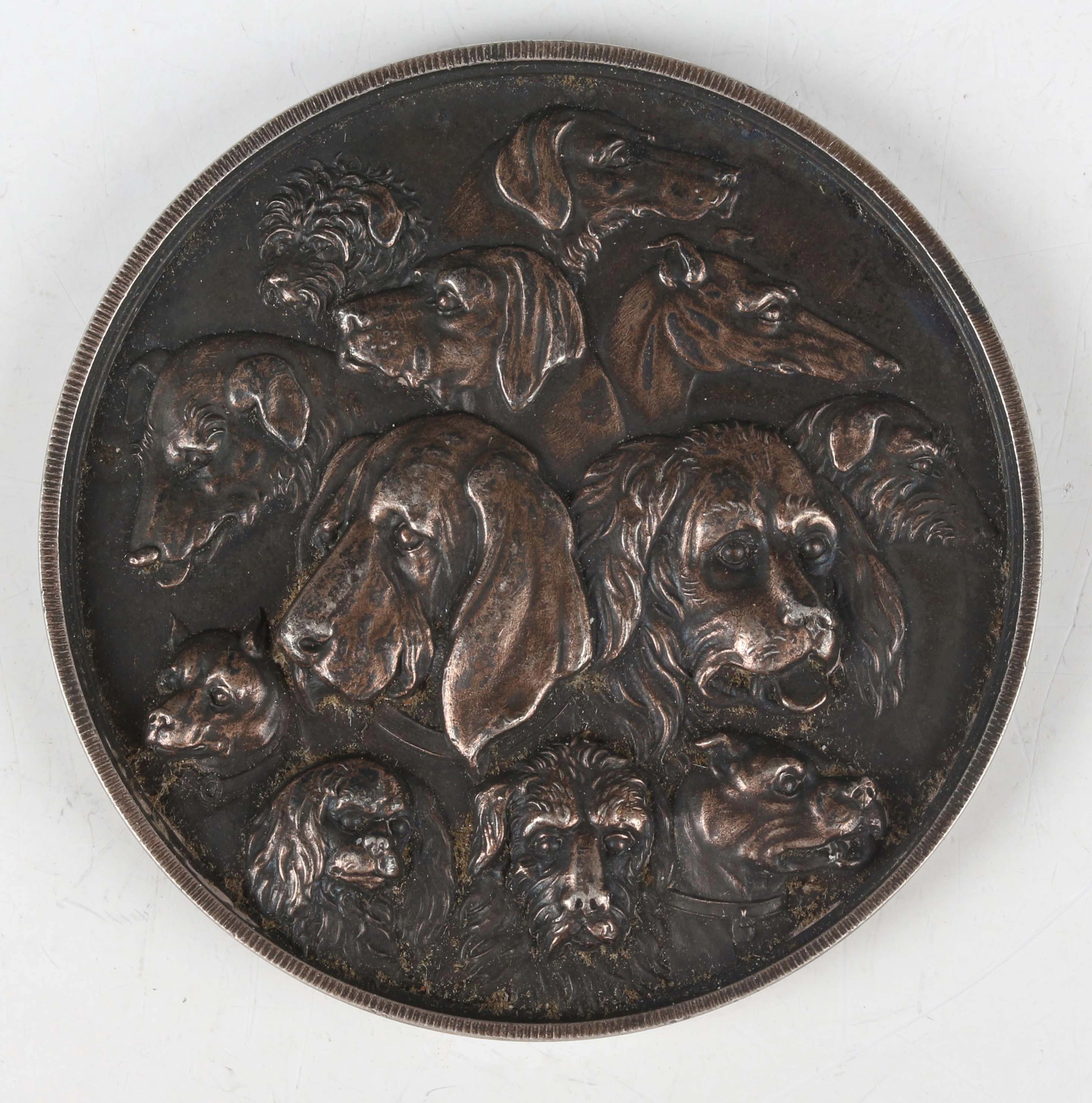 An unusual 19th century white metal medallion, obverse detailed with