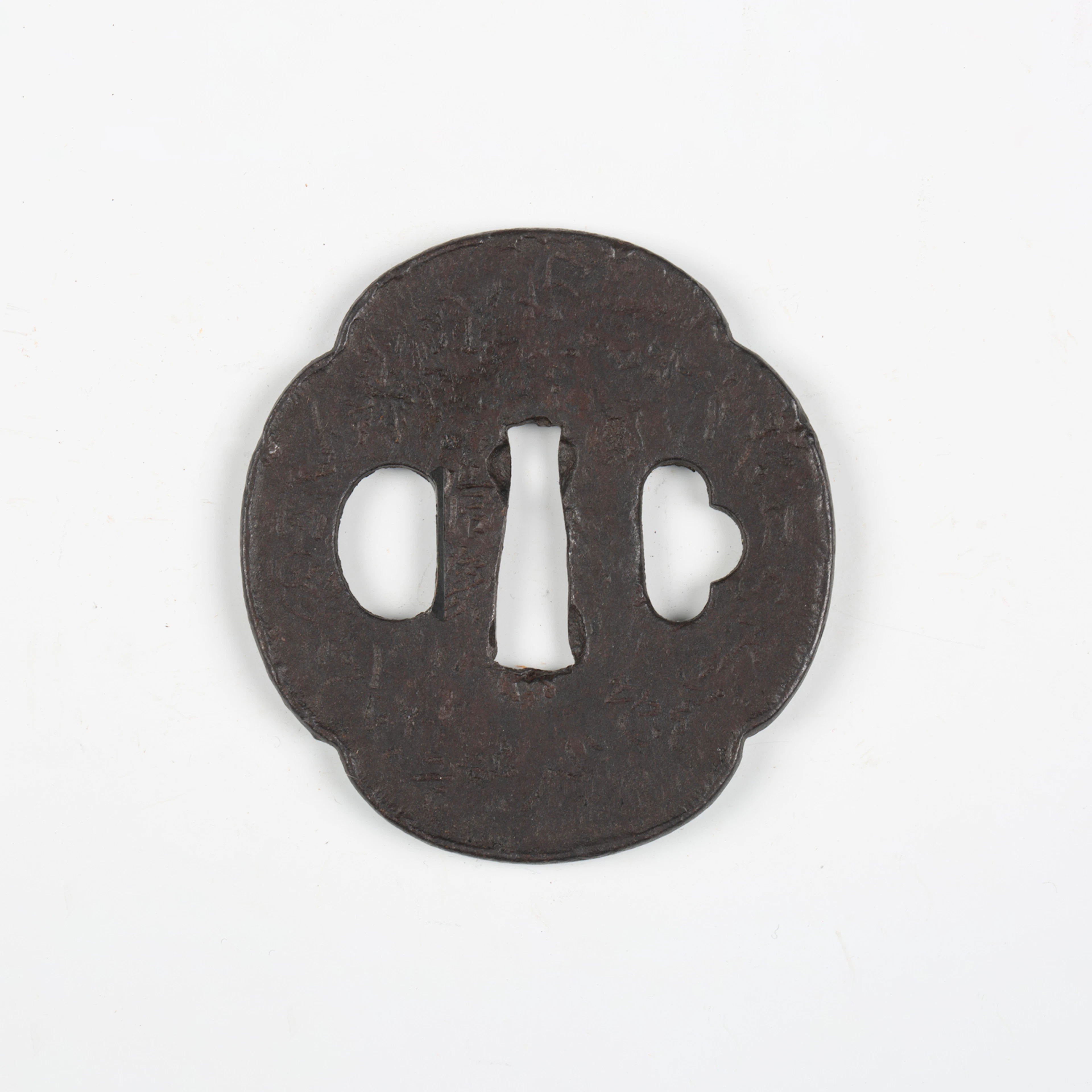 A Japanese shaped oval iron sukashi tsuba, probably late Muromachi