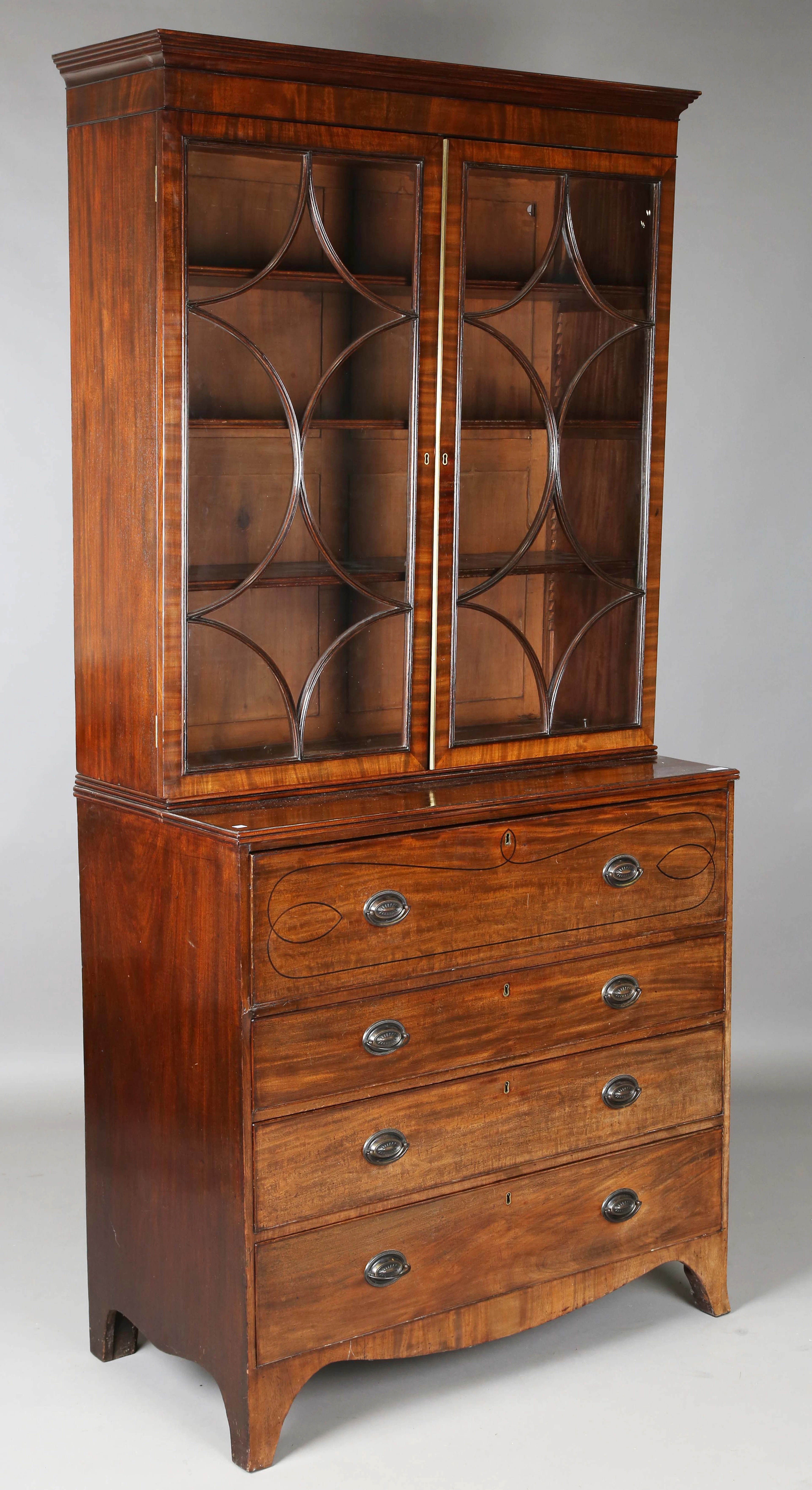A George IV mahogany secrétaire bookcase cabinet, the secrétaire drawer