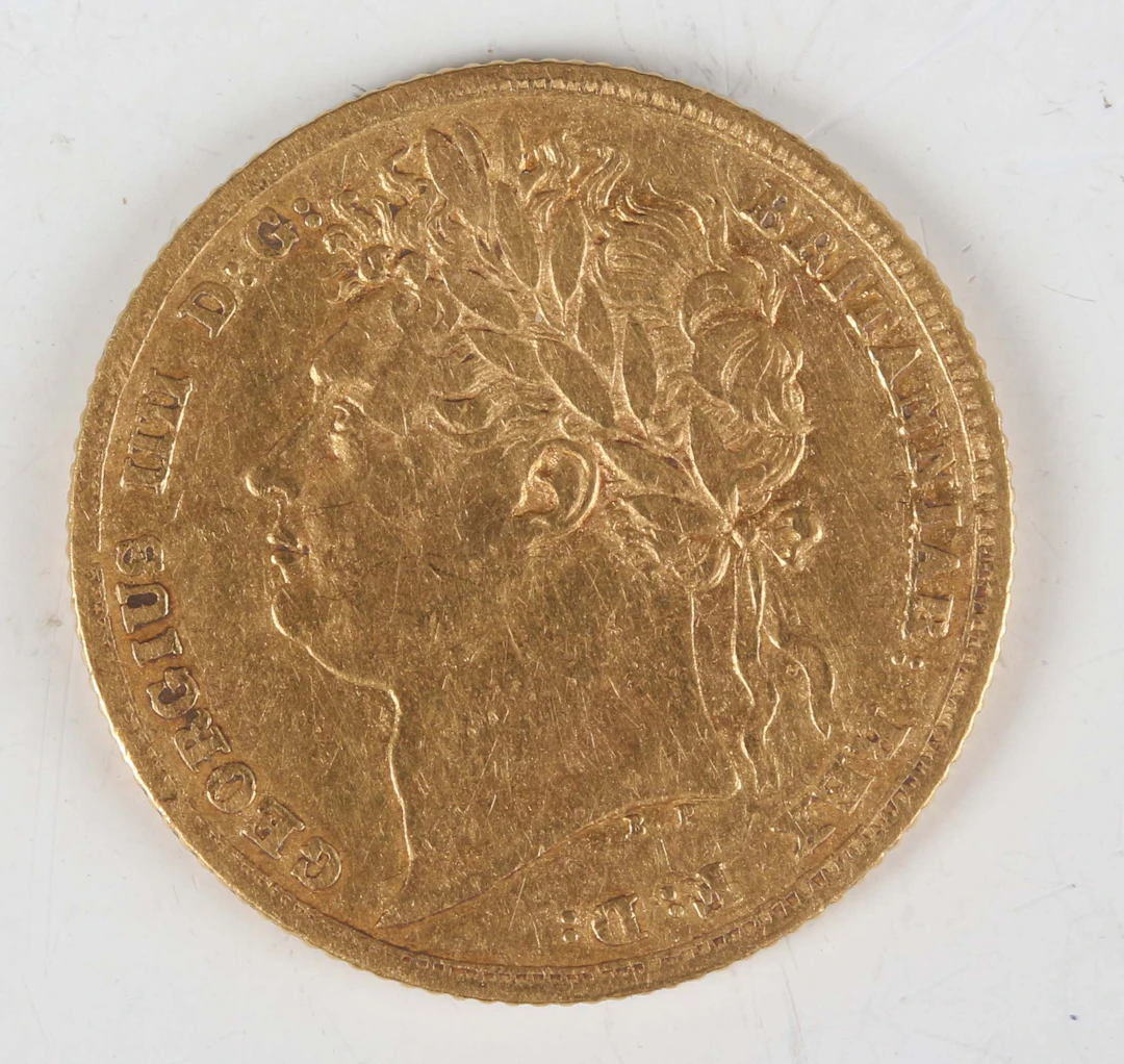 A George IV sovereign 1825, laureate head, Sp 3800 (fair/good). Note: