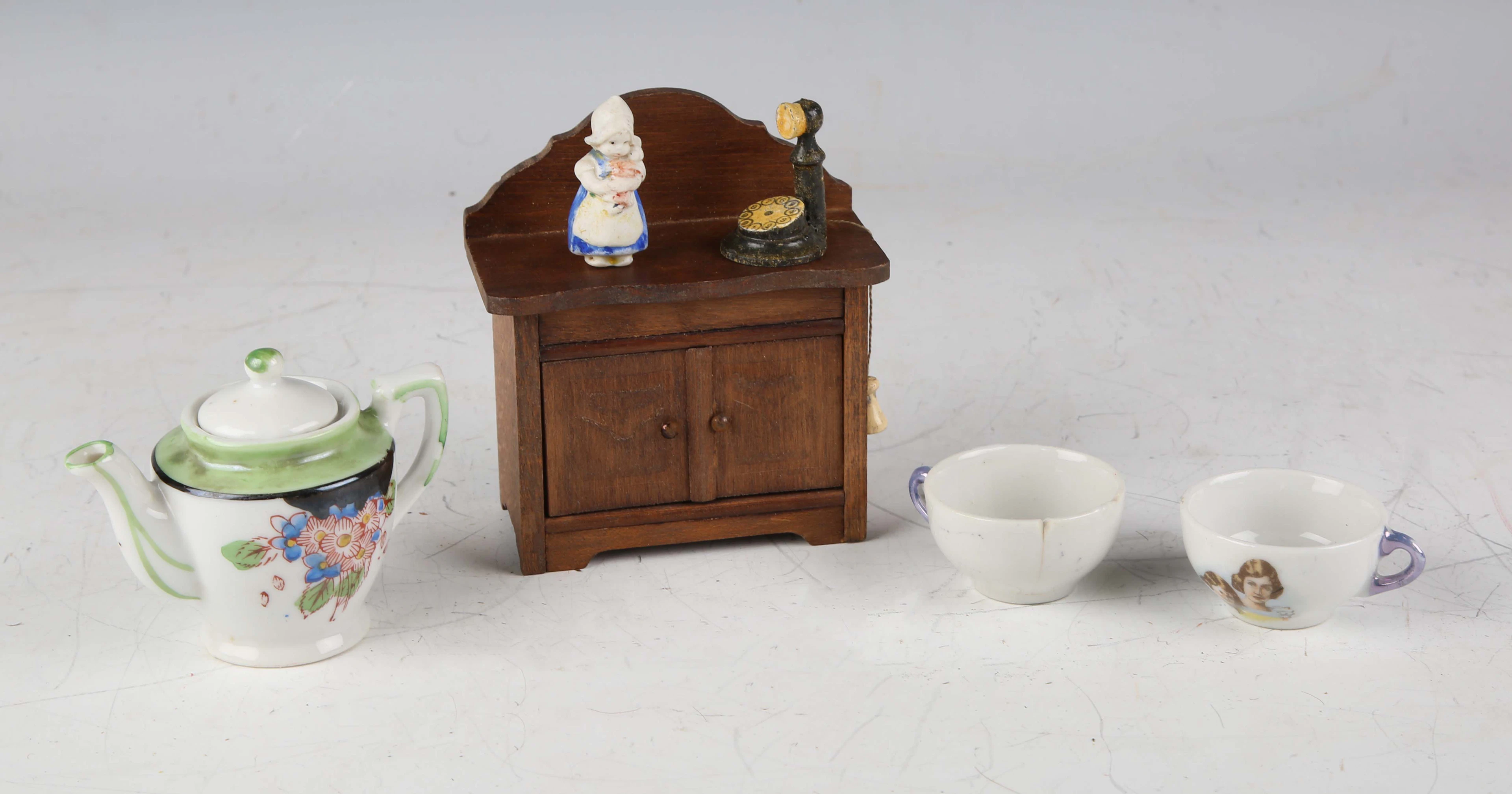 A Tri-ang mock-Tudor doll's house on a plinth base, height 41cm, width