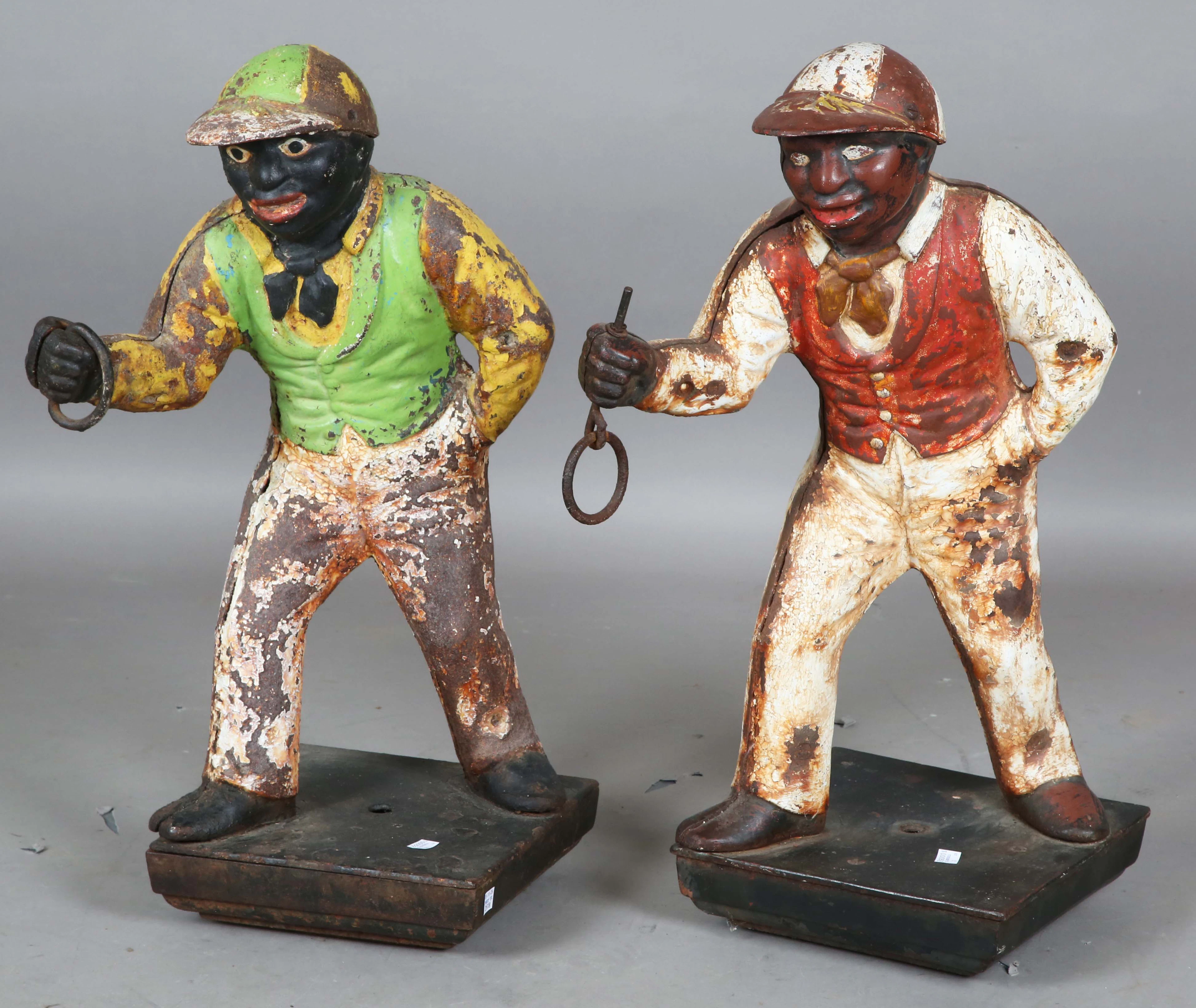 A pair of early 20th century painted cast iron horse tethering posts