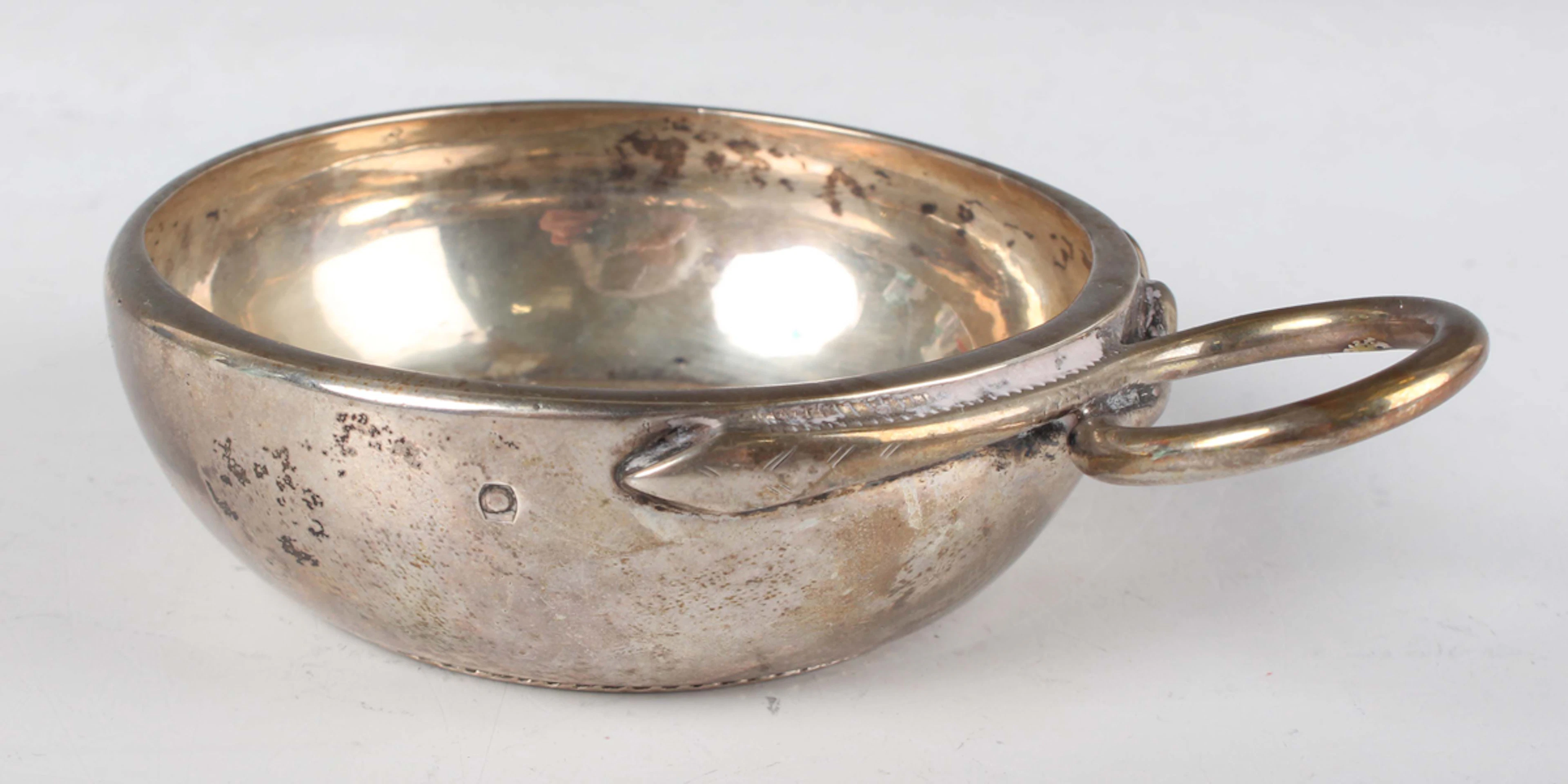 A 19th century French silver tasse de vin, the circular bowl inset