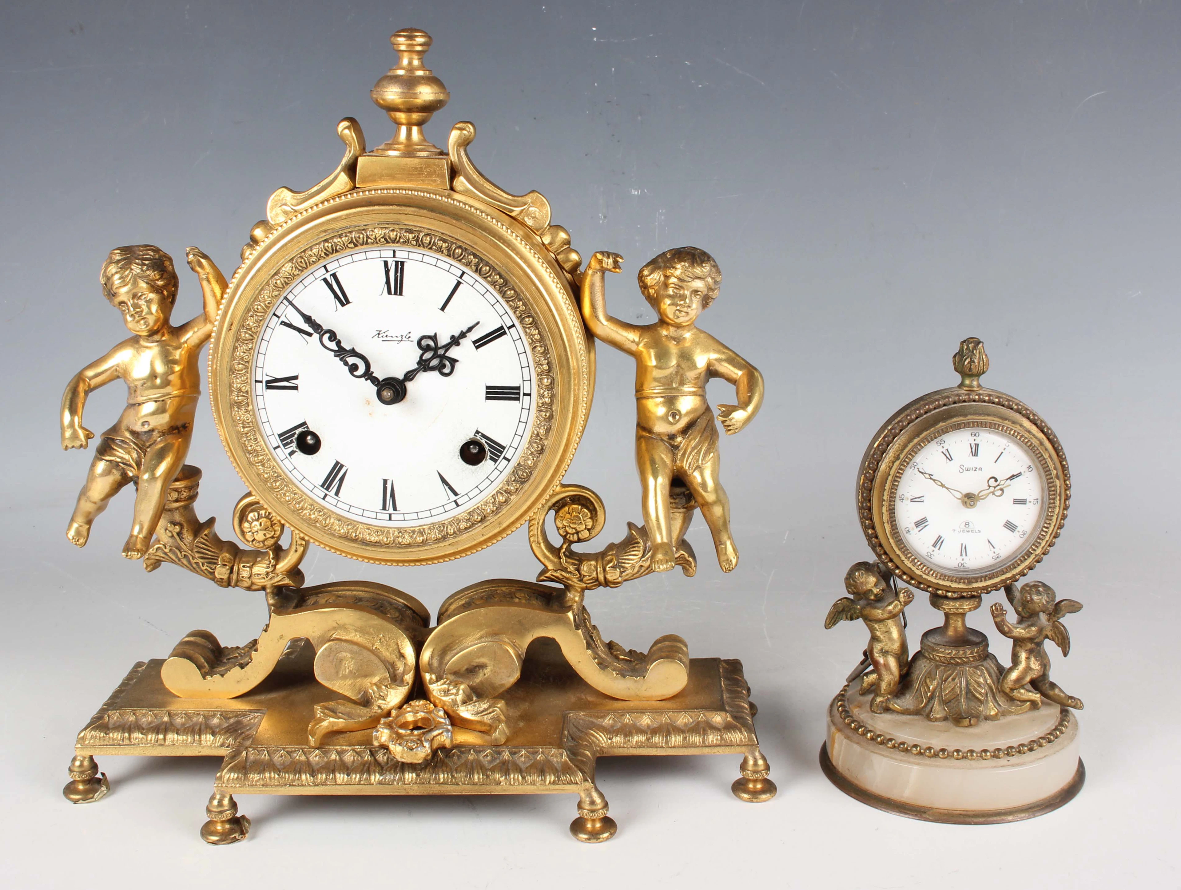 A 20th century gilt metal cased mantel clock with eight day movement