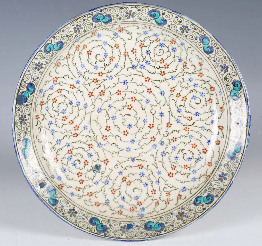 A Doulton Lambeth Persian Ware pottery circular dish, 1920s, painted
